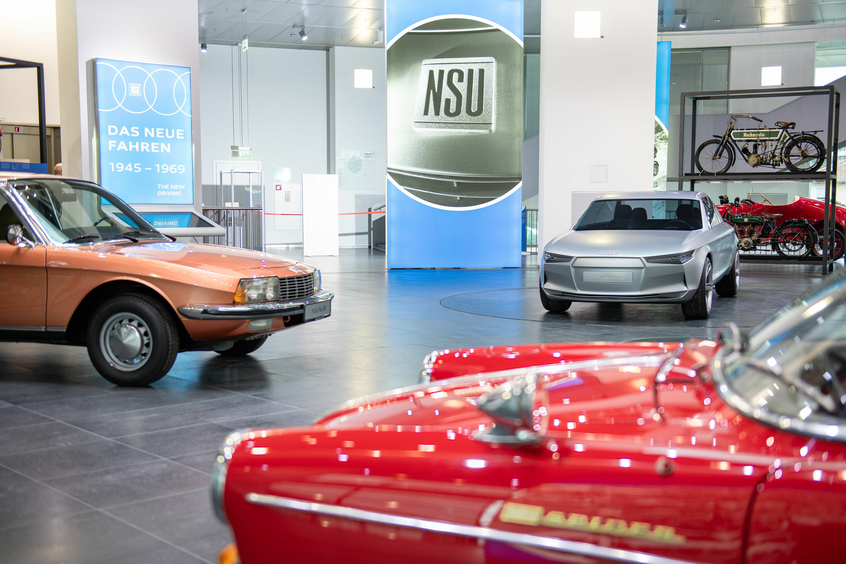 Off to the museum via app: Audi Tradition goes digital with its new special exhibition “Der fünfte Ring“ - Impression from the new special exhibition “Der fünfte Ring” at the Audi museum mobile: exhibits NSU/Wankel Spider (front), Ro 80 (left) and “Felix”...