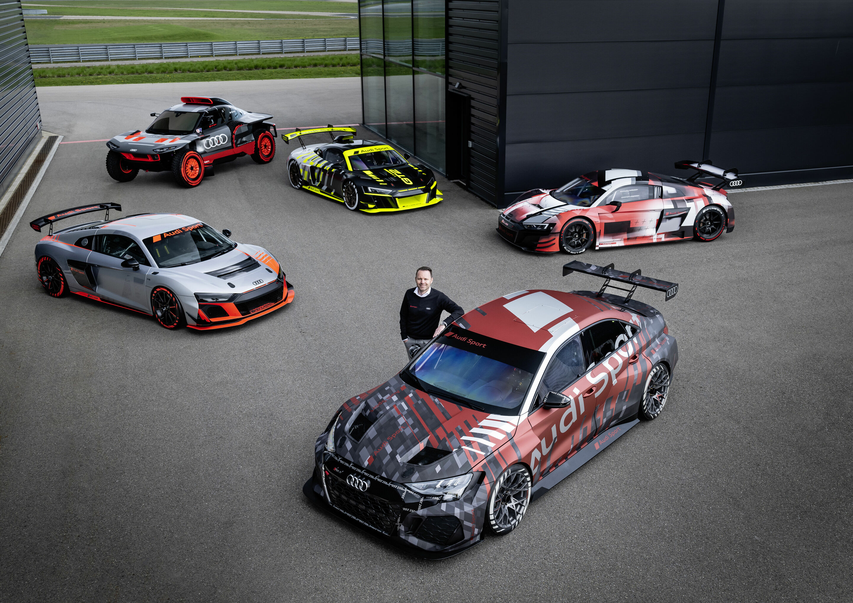 40 years Audi Sport GmbH - Rolf Michl, Managing Director of Audi Sport GmbH and Head of Motorsport at Audi

Models from left to right (static photo):
Audi R8 LMS GT4
Audi RS Q e-tron
Audi R8 LMS GT2
Audi RS 3 LMS
Audi R8 LMS GT3