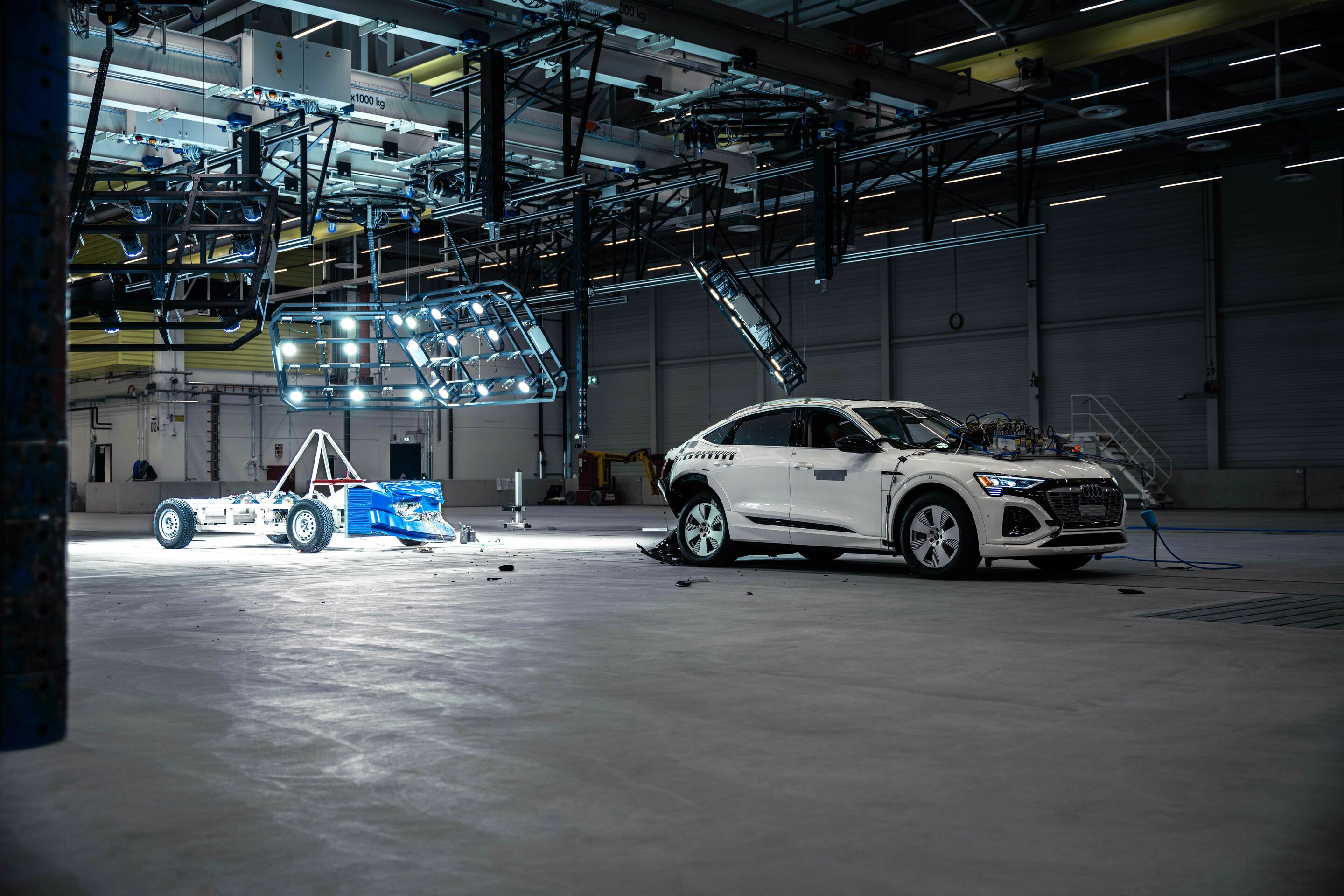 Audi opens new Vehicle Safety Center - Fast rear-end crash: The mobile deformable barrier hits the vehicle at 80 km/h.