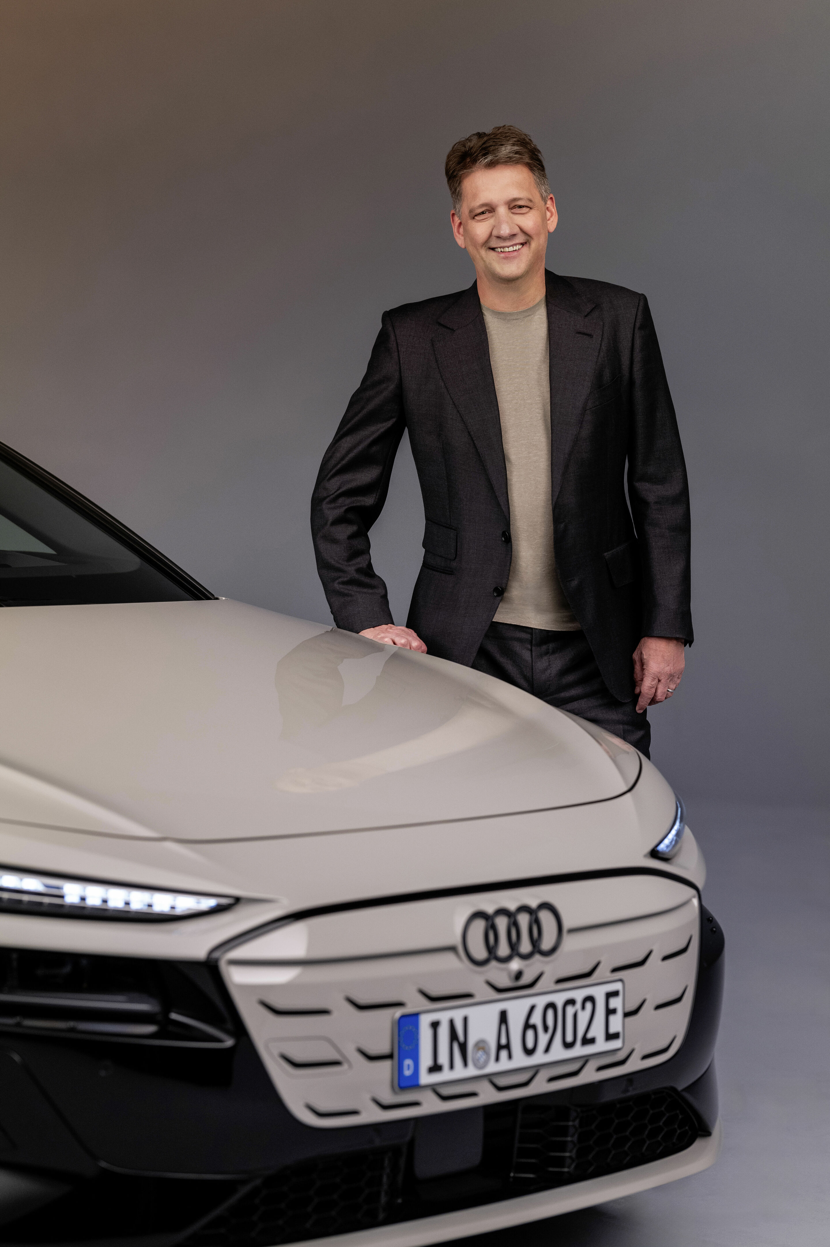 Gernot Döllner, CEO of AUDI AG, beside the new A6 Sportback e-tron