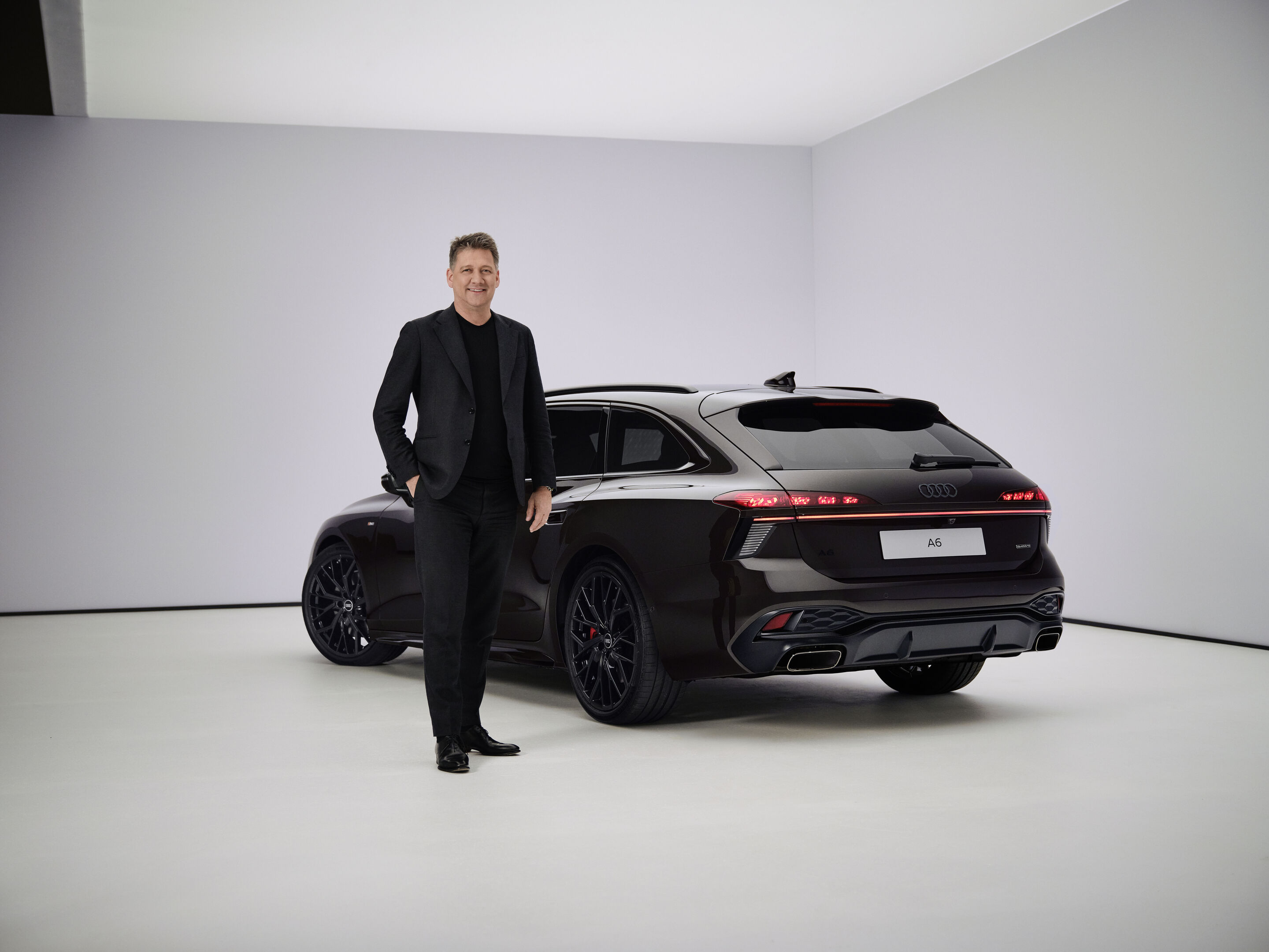 Audi A6 Avant - Audi CEO Gernot Döllner next to the Audi A6 Avant