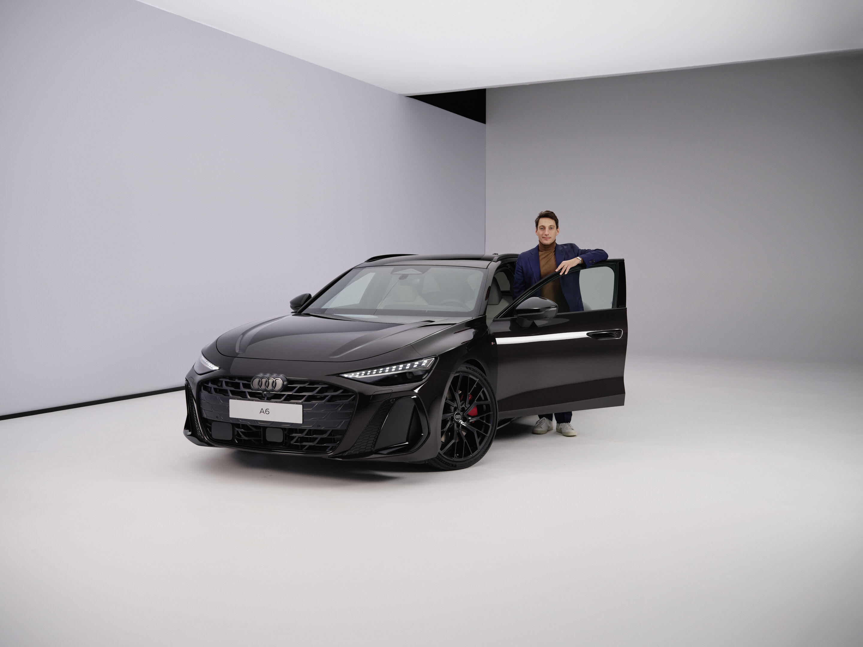 Audi A6 Avant - Geoffrey Bouquot, Member of the Board of Management at AUDI AG for Technical Development, next to the Audi A6 Avant
