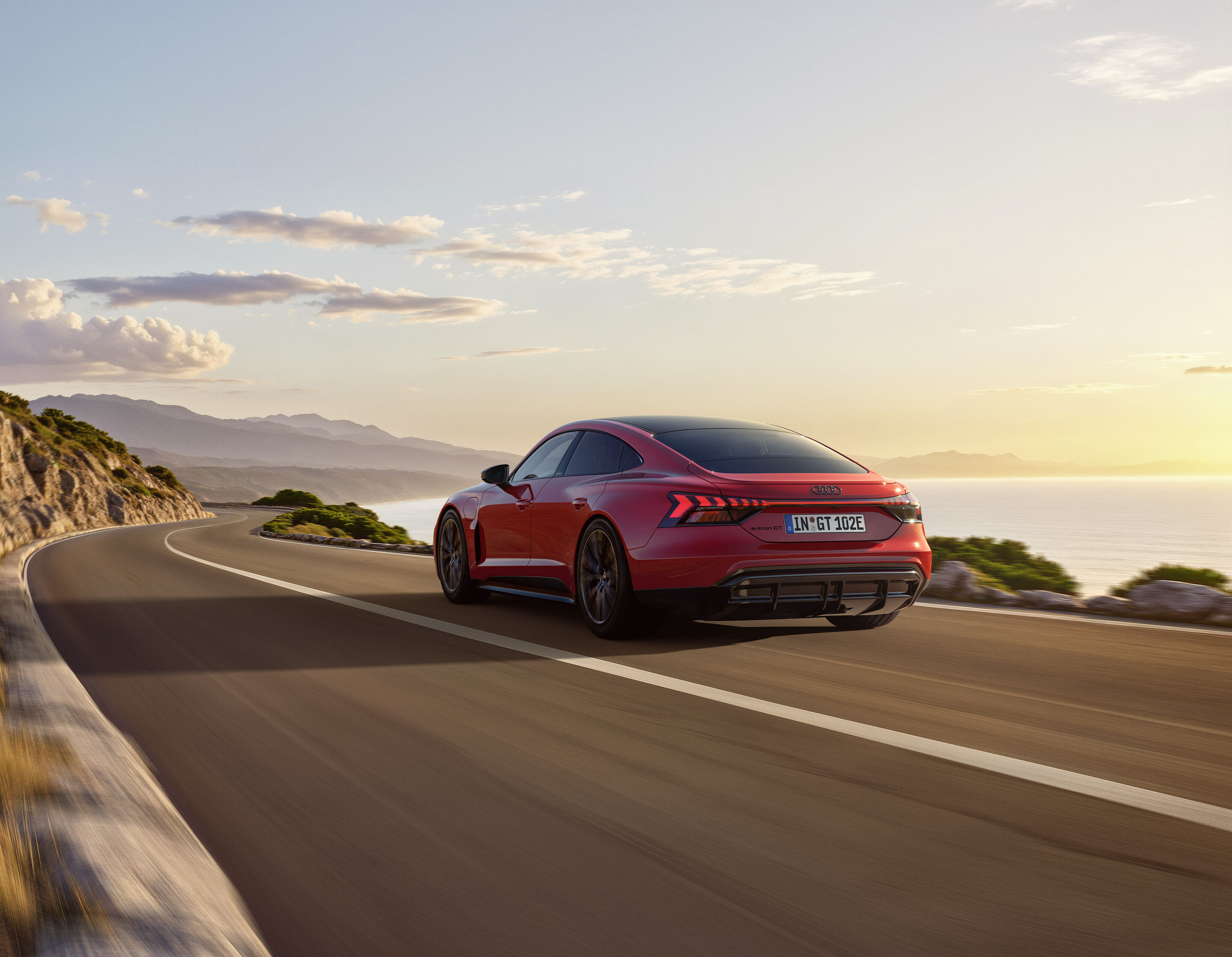 Entering the premium class: Audi e-tron GT quattro combines emotional design, performance, and comfort - The Audi e-tron GT quattro combines dynamic driving with a high degree of everyday practicality. The background shown is AI-generated.