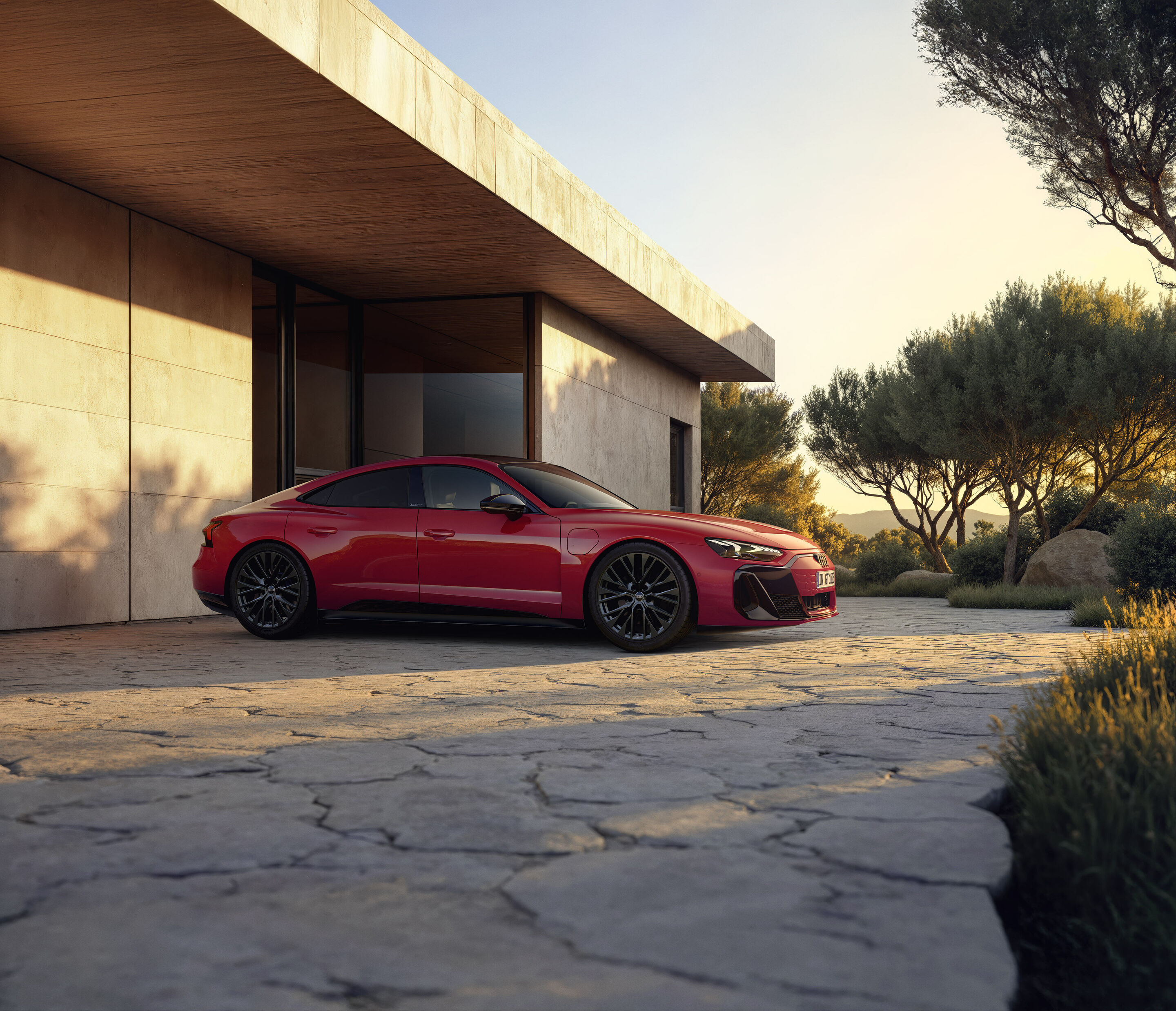 Entering the premium class: Audi e-tron GT quattro combines emotional design, performance, and comfort - Large wheels, a sleek coupé-like silhouette, and an extended wheelbase contribute to the e-tron GT quattro’s sporty proportions. The background shown...