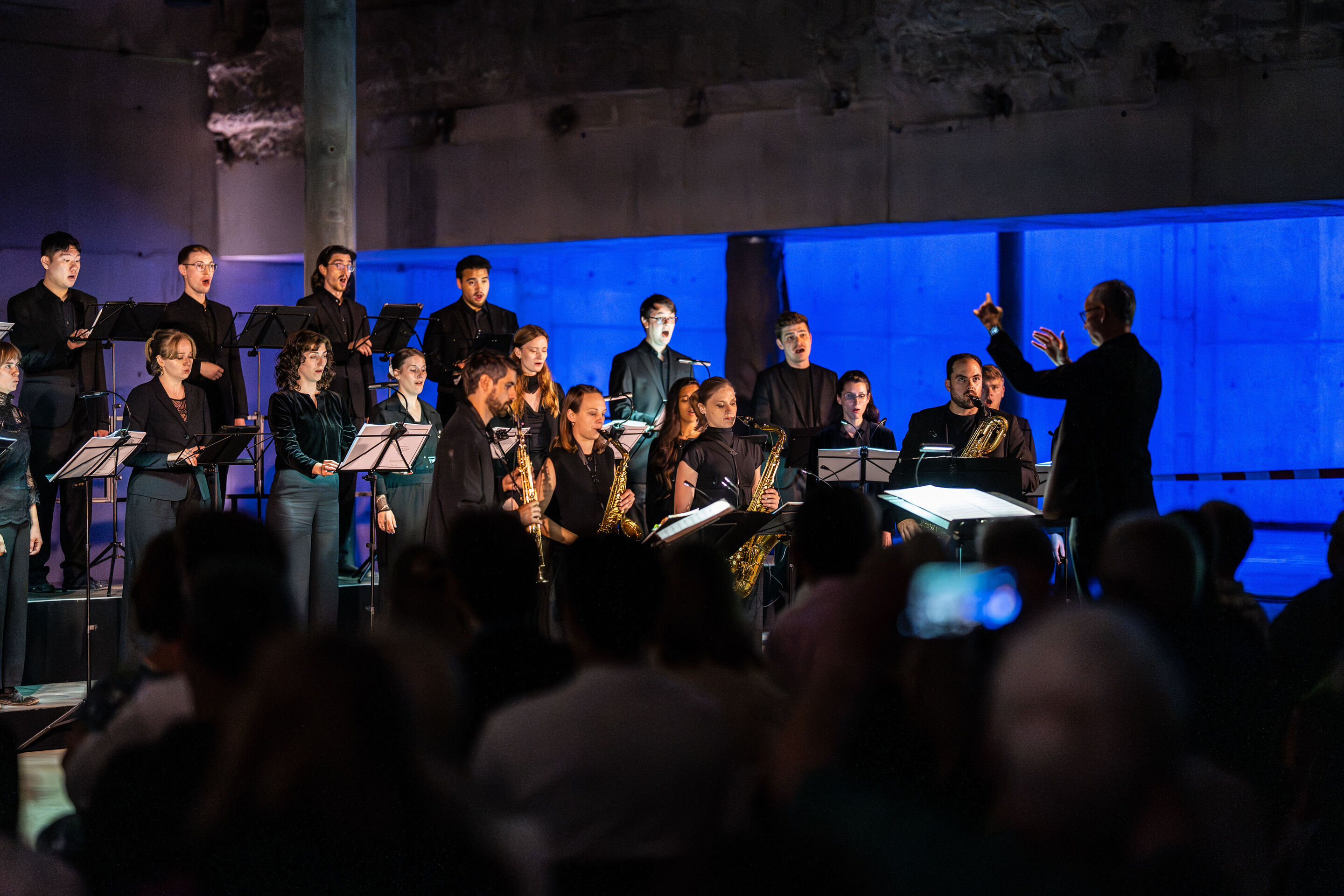 “Lux!”: Theatrical concert at the construction site of the MCAD; Arcis Saxophone Quartet, vocal ensemble LauschWerk - Members of the vocal ensemble LauschWerk and the Arcis Saxophone Quartet perform on stage at the construction site of the new Museum...