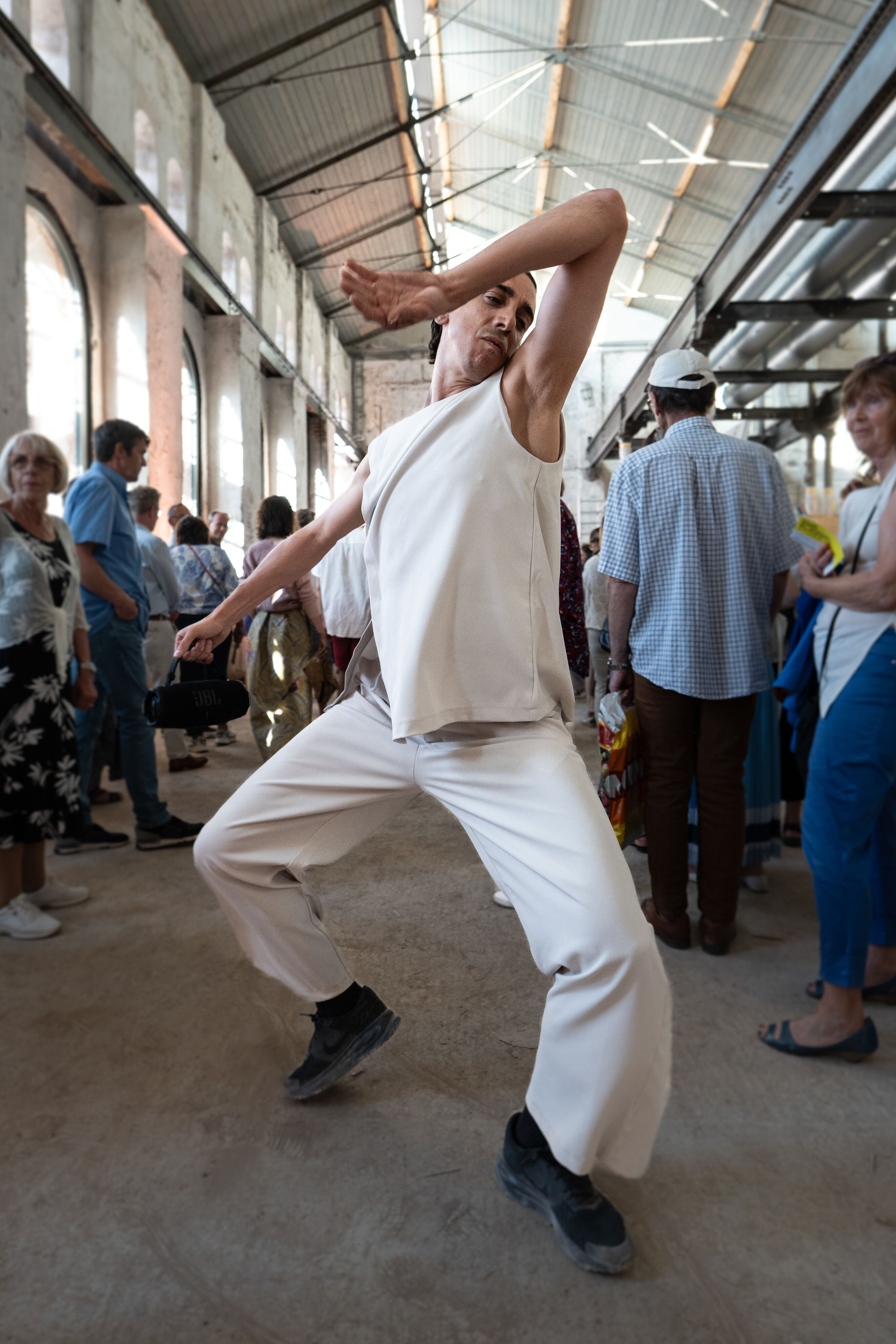 “Lux!”: Theatrical concert at the construction site of the MCAD; Arcis Saxophone Quartet, vocal ensemble LauschWerk - On the construction site of the new Museum of Concrete Art and Design Ingolstadt, Cristian Cucco moves through the audience during the...