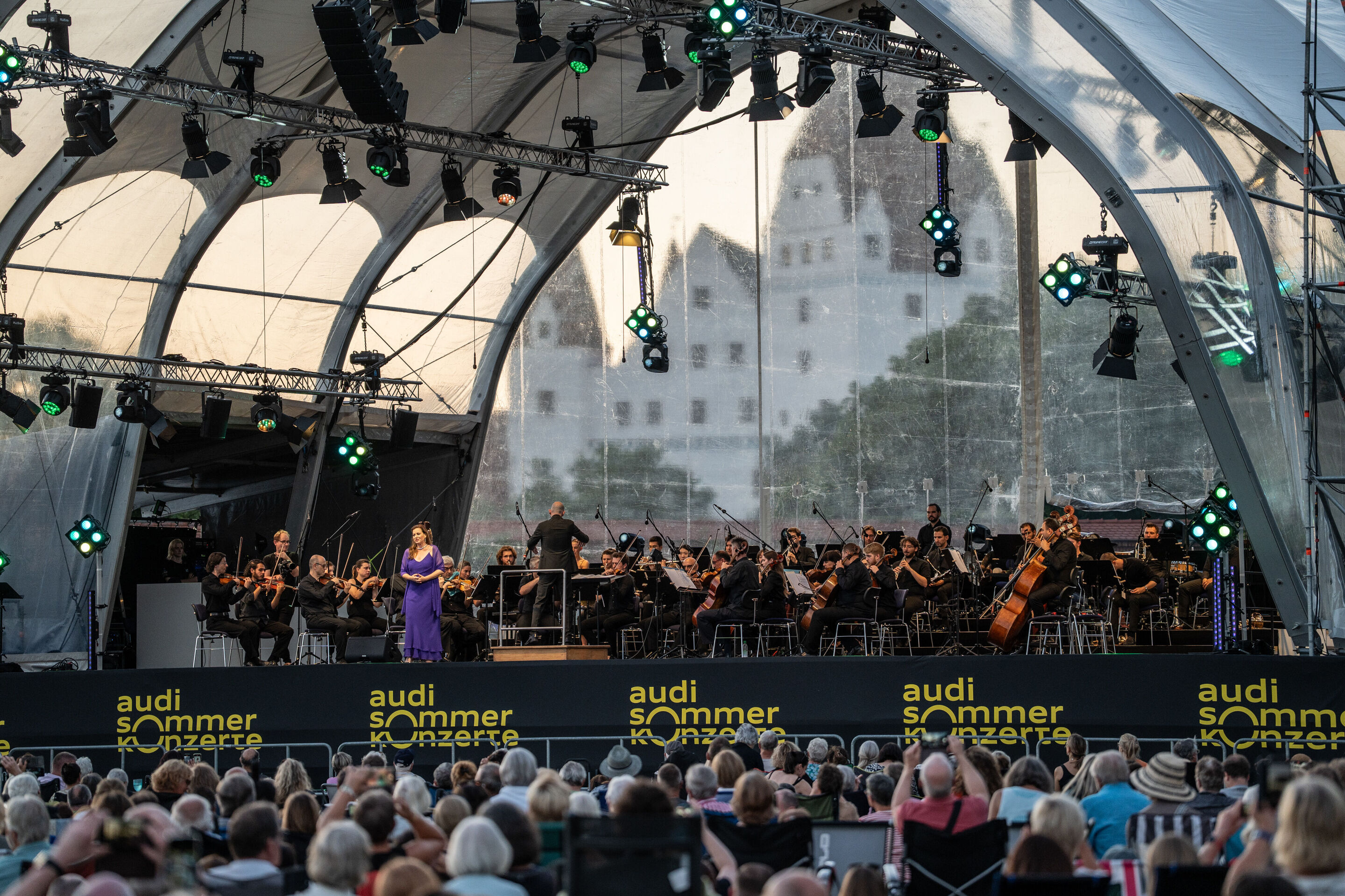 Classic Open Air – German–Italian opera night with the Georgian Chamber Orchestra Ingolstadt - Soprano Hila Baggio stands on stage at the Audi Summer Concerts Classic Open Air event in Klenzepark, while the Georgian Chamber Orchestra Ingolstadt, conducted...