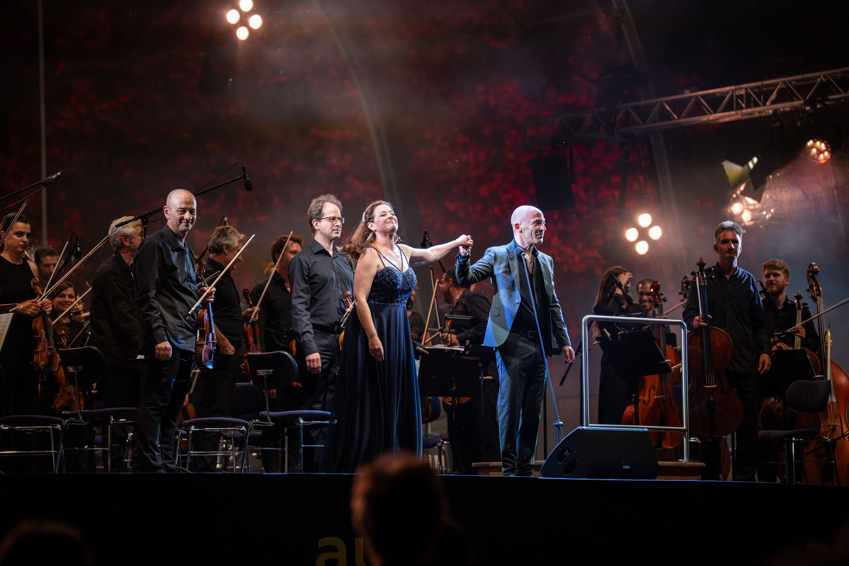 Classic Open Air – German–Italian opera night with the Georgian Chamber Orchestra Ingolstadt - Soprano Hila Baggio, conductor Ariel Zuckermann, and the Georgian Chamber Orchestra Ingolstadt stand on stage at the Audi Summer Concerts Classic Open Air event...