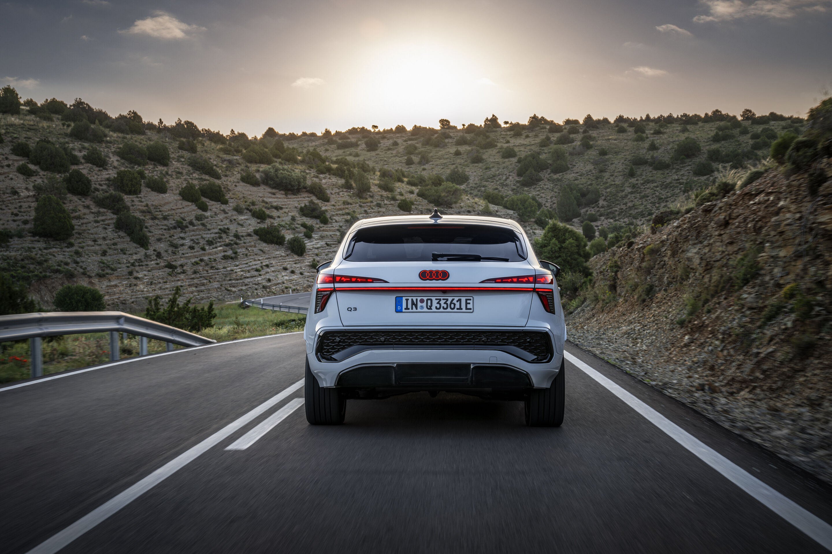 Audi Q3 Sportback e-hybrid - Glacier white metallic, dynamic outdoor shot, exterior, rear view