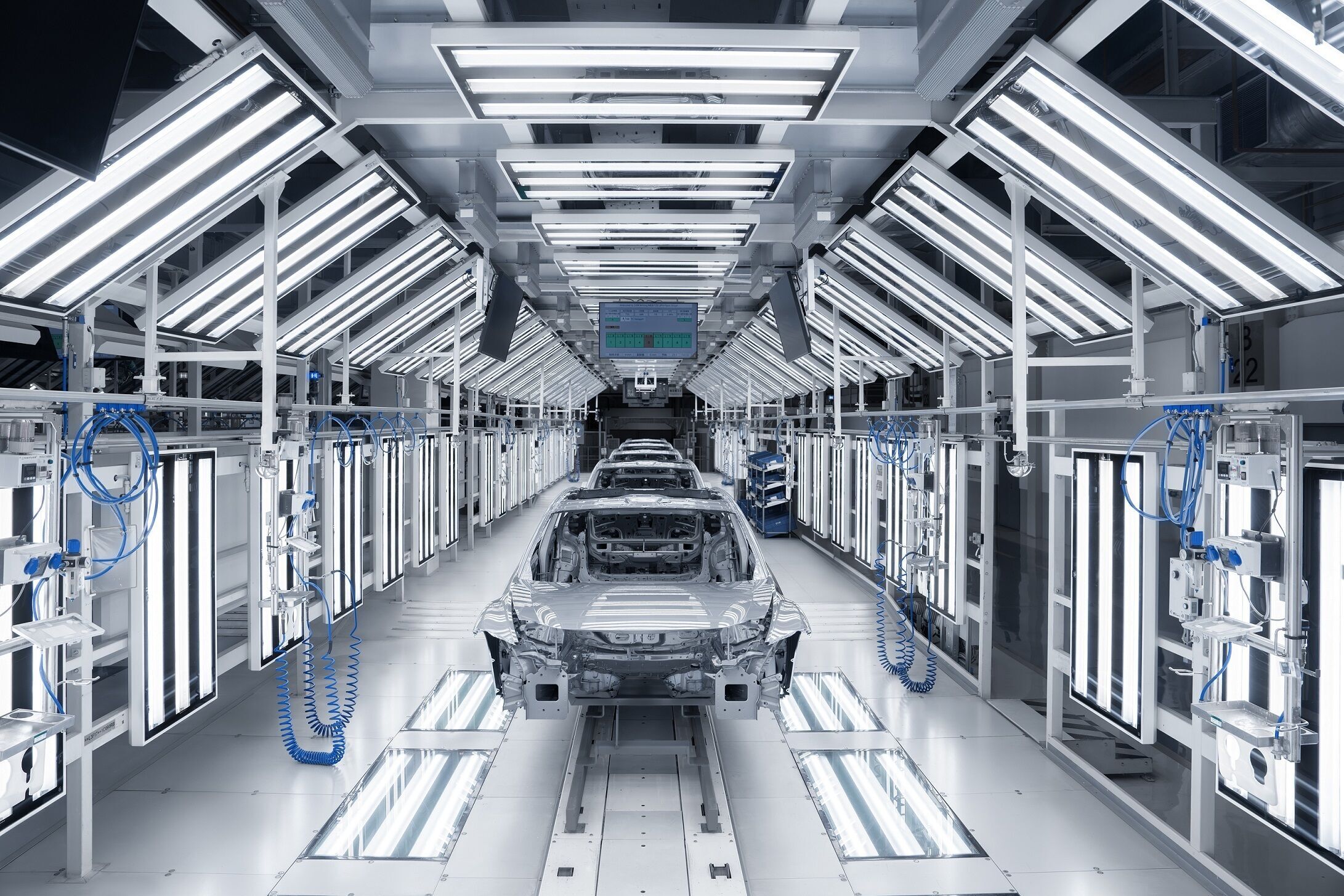 AUDI E5 Sportback - The AUDI E5 Sportback is produced at a dedicated manufacturing facility located on the premises of the SAIC Volkswagen plant in Anting, Shanghai. Pictured: vehicle assembly and surface inspection.