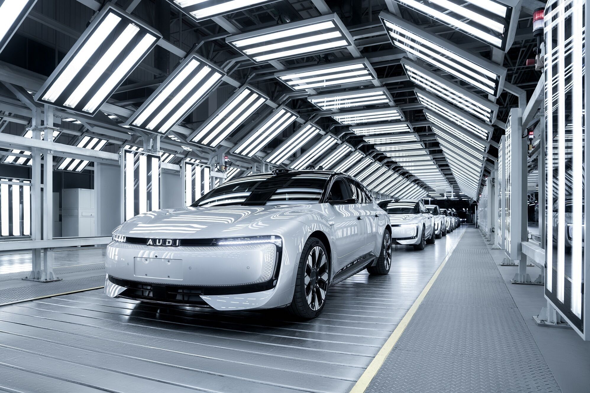 AUDI E5 Sportback - The AUDI E5 Sportback is produced at a dedicated manufacturing facility located on the SAIC Volkswagen plant in Anting, Shanghai. Pictured: vehicle assembly, finishing, and surface inspection.
