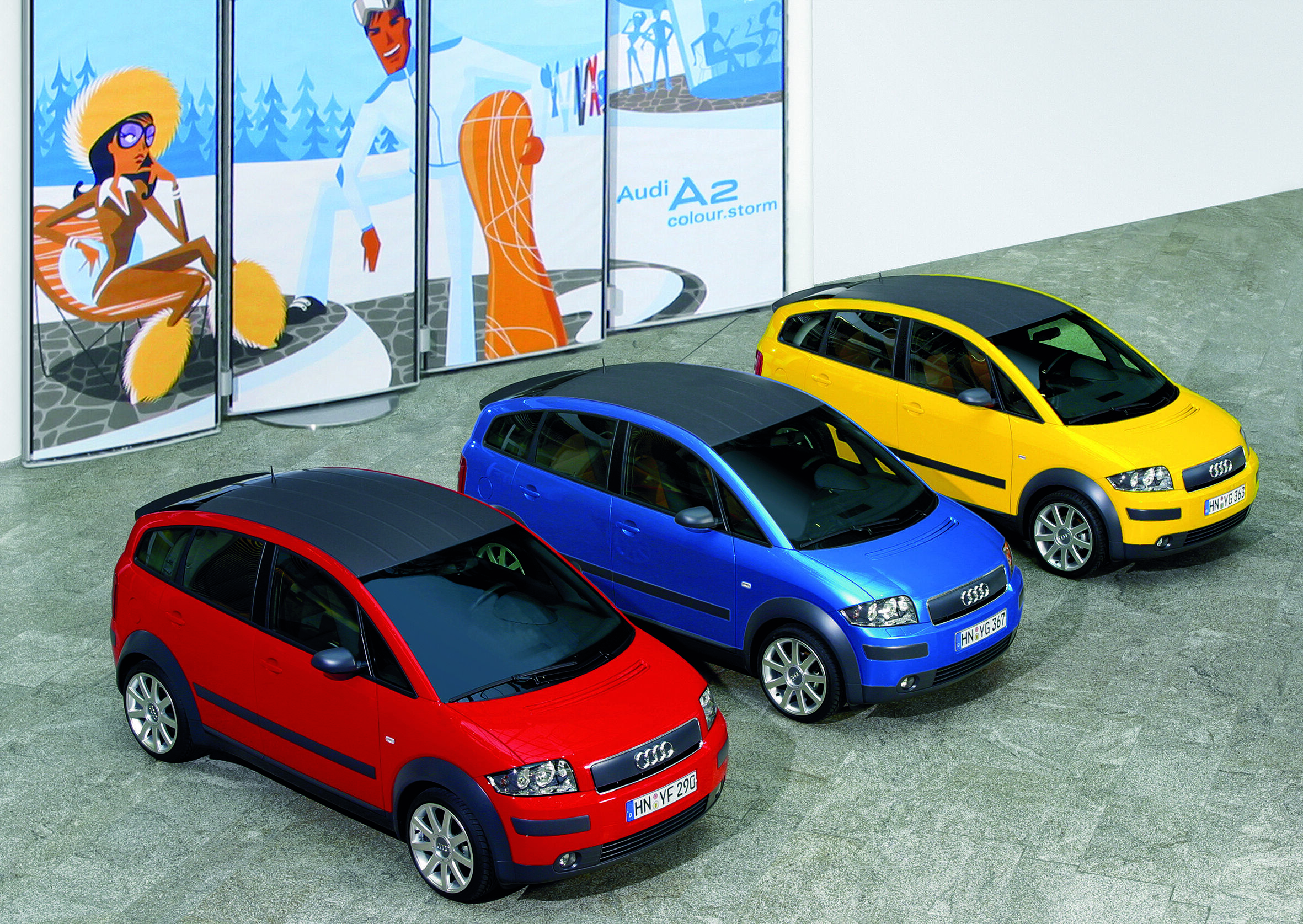 Leading light: the Audi A2 launched 25 years ago - The Audi A2 was launched in 2000 – 25 years ago. The picture shows the special “colour.storm” edition in Misano red pearl effect, Sprint blue pearl effect and Imola yellow. (from left)