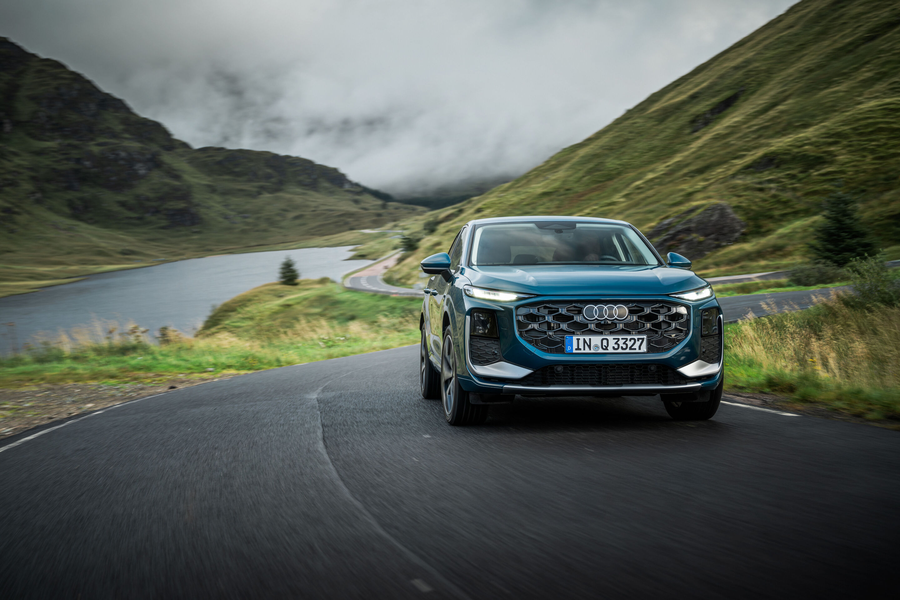 Compact class meets Celtic charm: the new  Audi Q3 in Scotland - Malpelo blue metallic, outdoor dynamic photo, exterior, front view