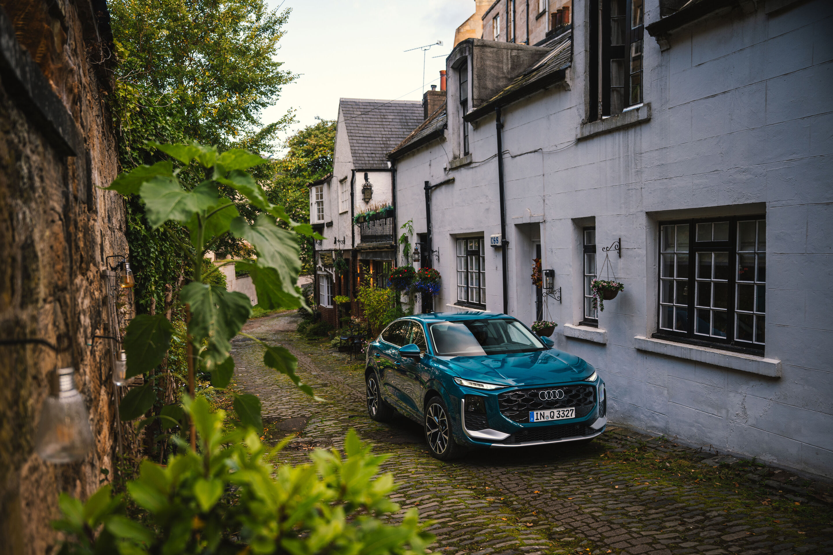 Compact class meets Celtic charm: the new  Audi Q3 in Scotland - Malpelo blue metallic, outdoor static photo, exterior, three-quarter front view