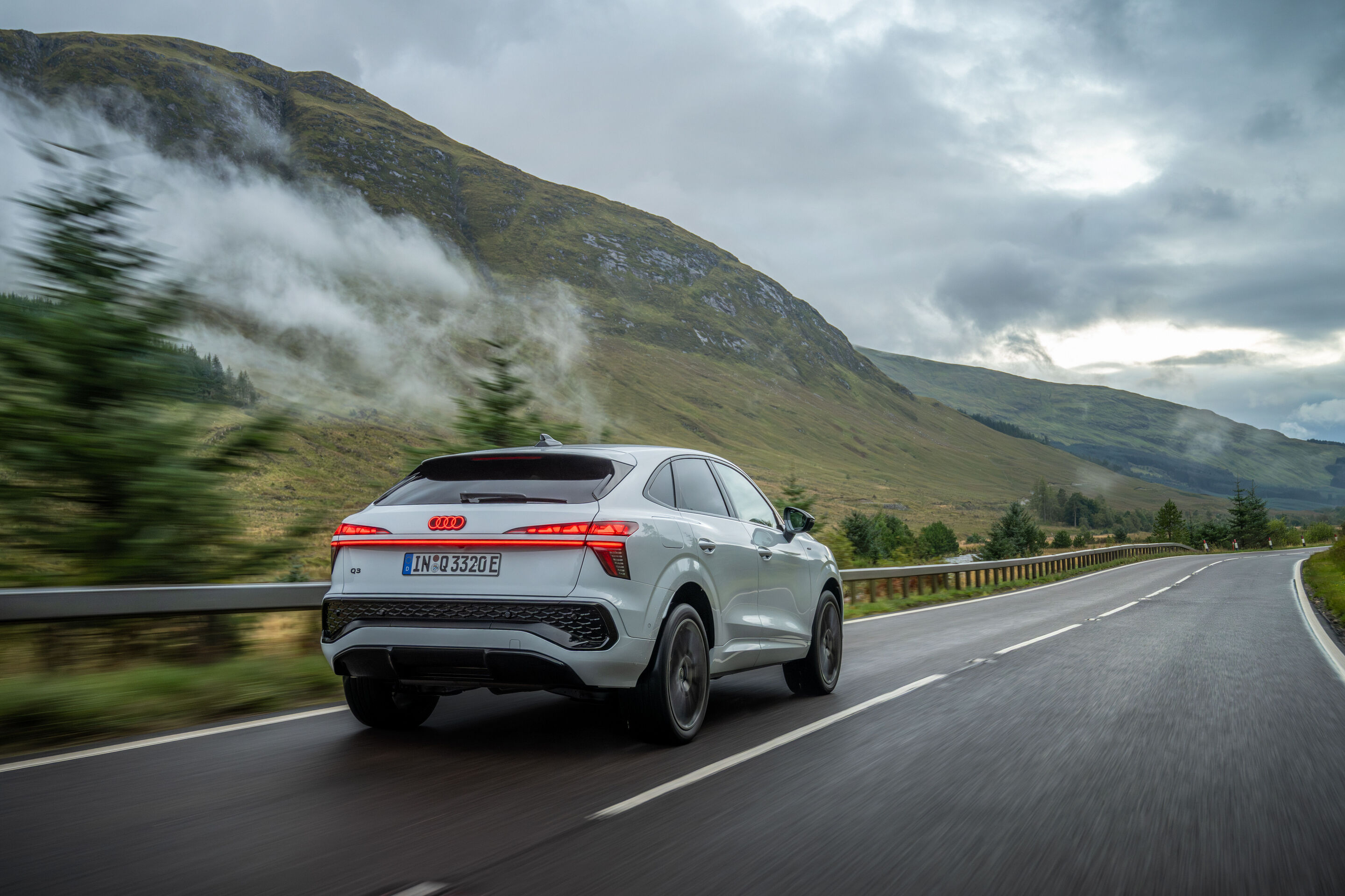Compact class meets Celtic charm: the new  Audi Q3 in Scotland - Glacier white metallic, outdoor dynamic photo, exterior, three-quarter rear view