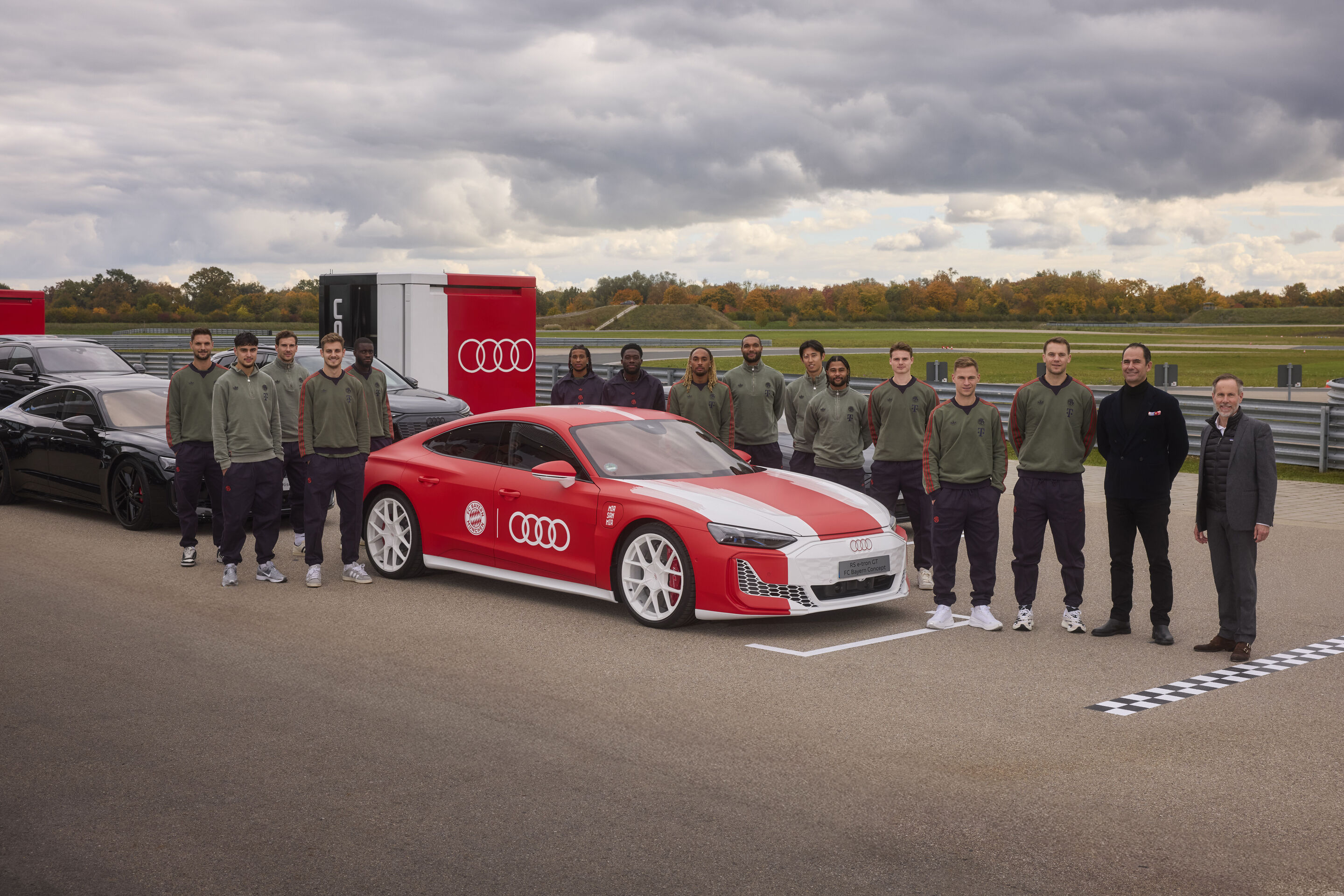 Audi hands over new company cars to FC Bayern Munich - Andreas Henke (Vice President Brand Audi), Marco Schubert (Board Member for Sales and Marketing, AUDI AG), captain Manuel Neuer (from right), and the FC Bayern Munich team gather around the Audi RS...