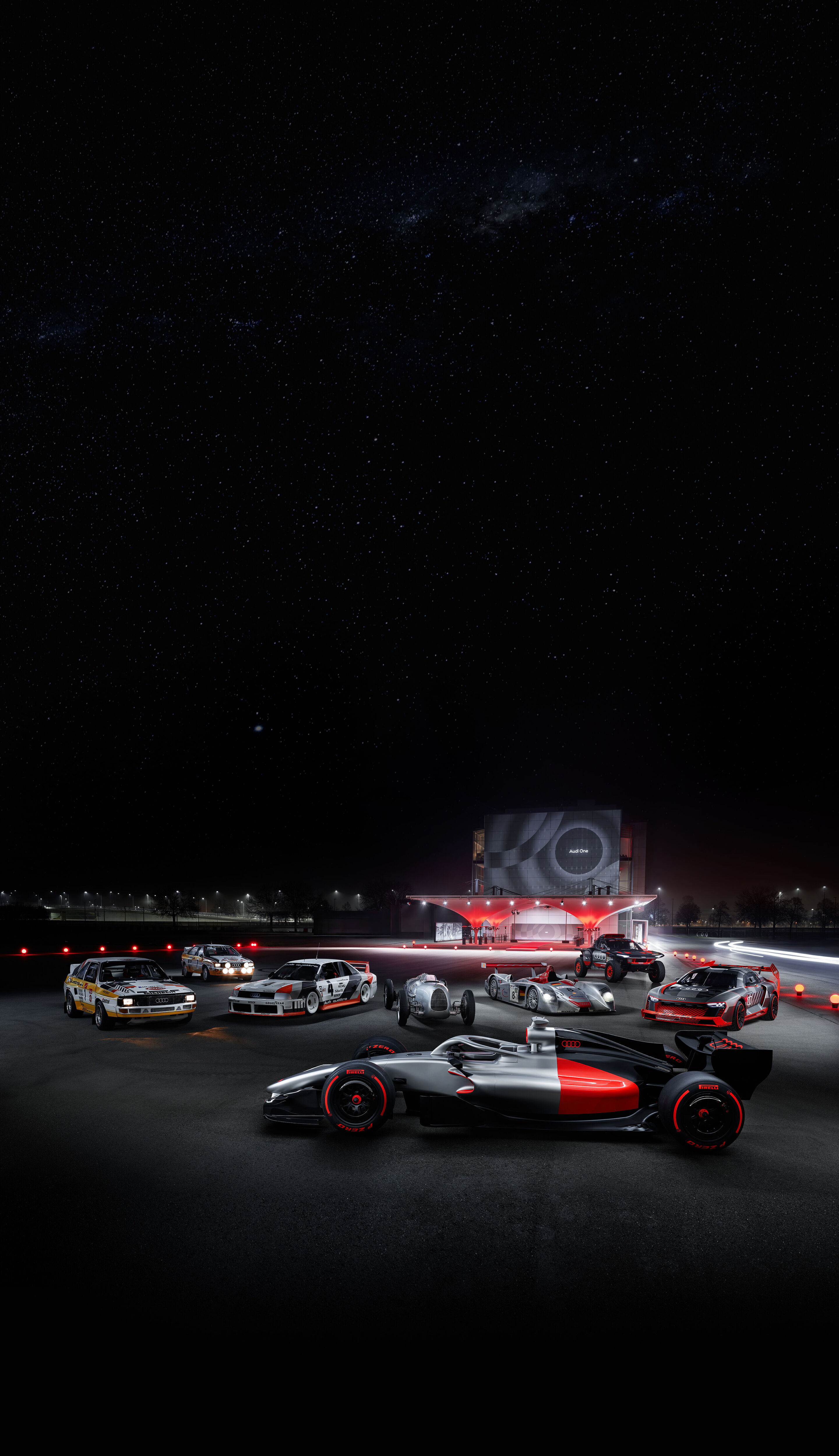 Motorsport Legenden begrüßen den Audi R26 Concept - Event „Audi One“ in München, 12. November 2025. Im Bild (v. l. n. r): Audi Sport quattro Rallye S1, Audi quattro Rallye A2, Audi 90 quattro IMSA GTO, Audi R26 Concept, Auto Union Typ C, Audi R8 LMP,...