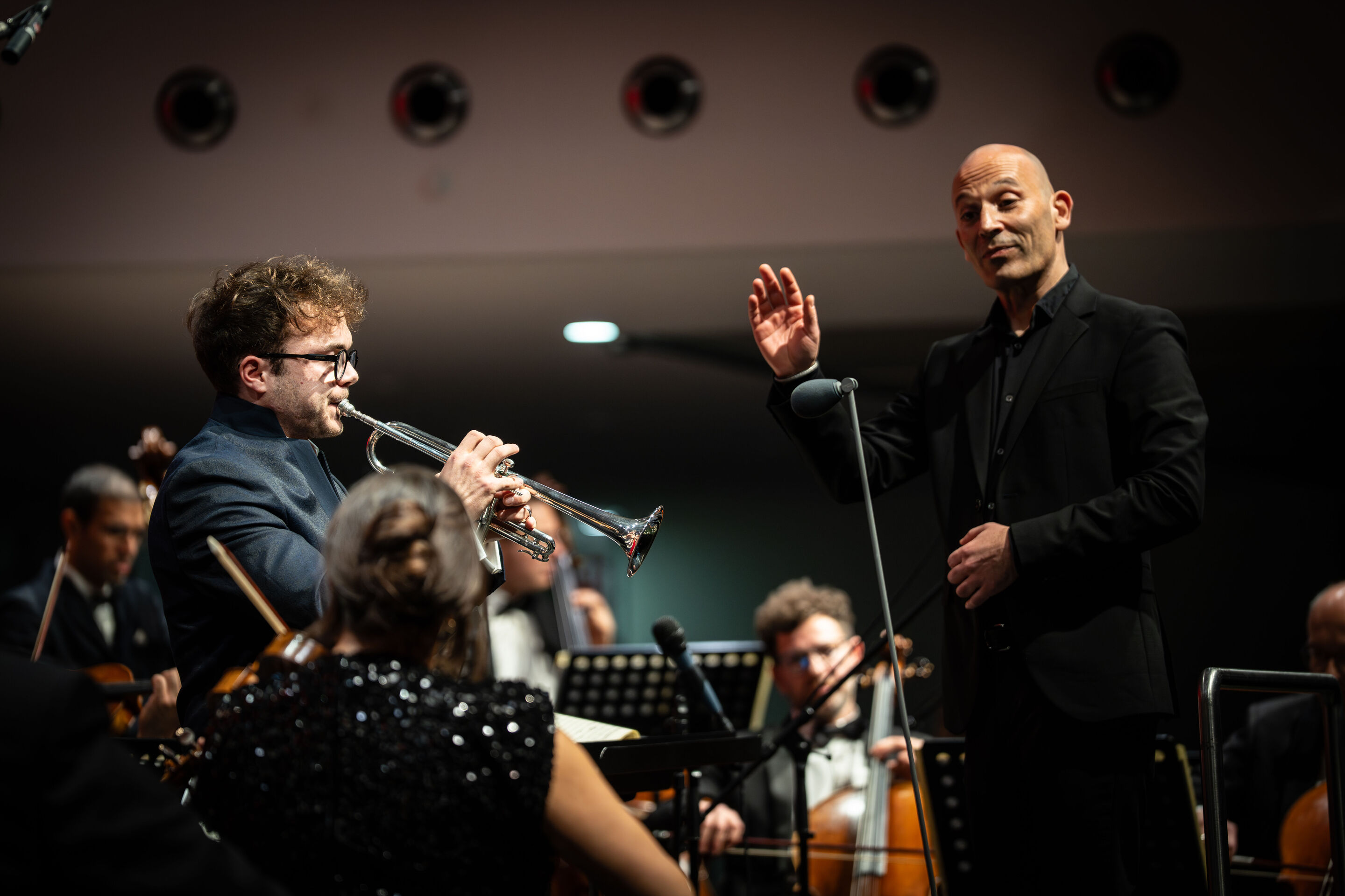 Audi Christmas Concert 2025 - Trumpeter Robin Paillet and conductor Ariel Zuckermann (from left) on stage at the Audi Christmas Concert 2025