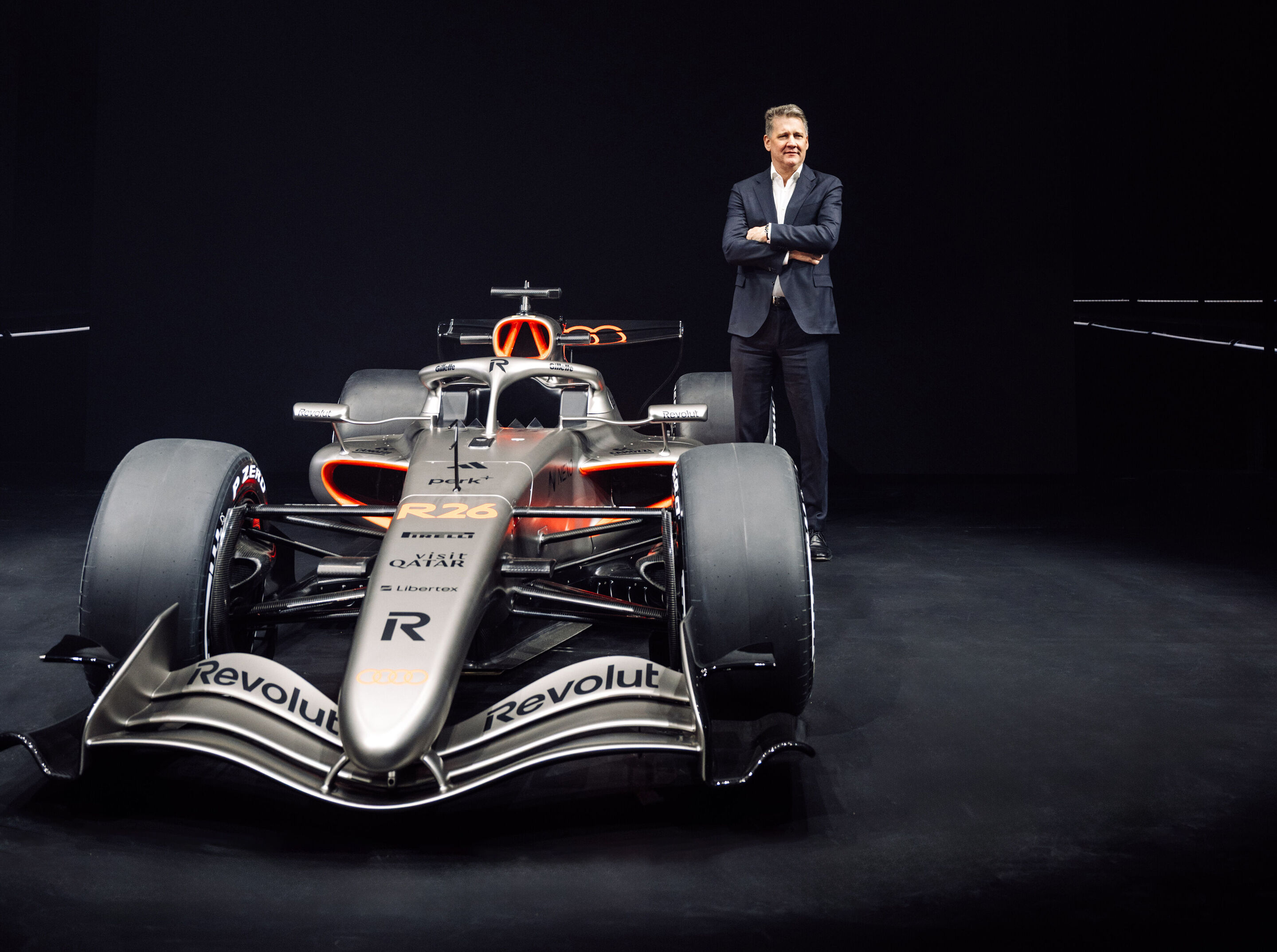 Team launch Audi Revolut F1 Team - Audi CEO Gernot Döllner next to the Audi R26 in race livery