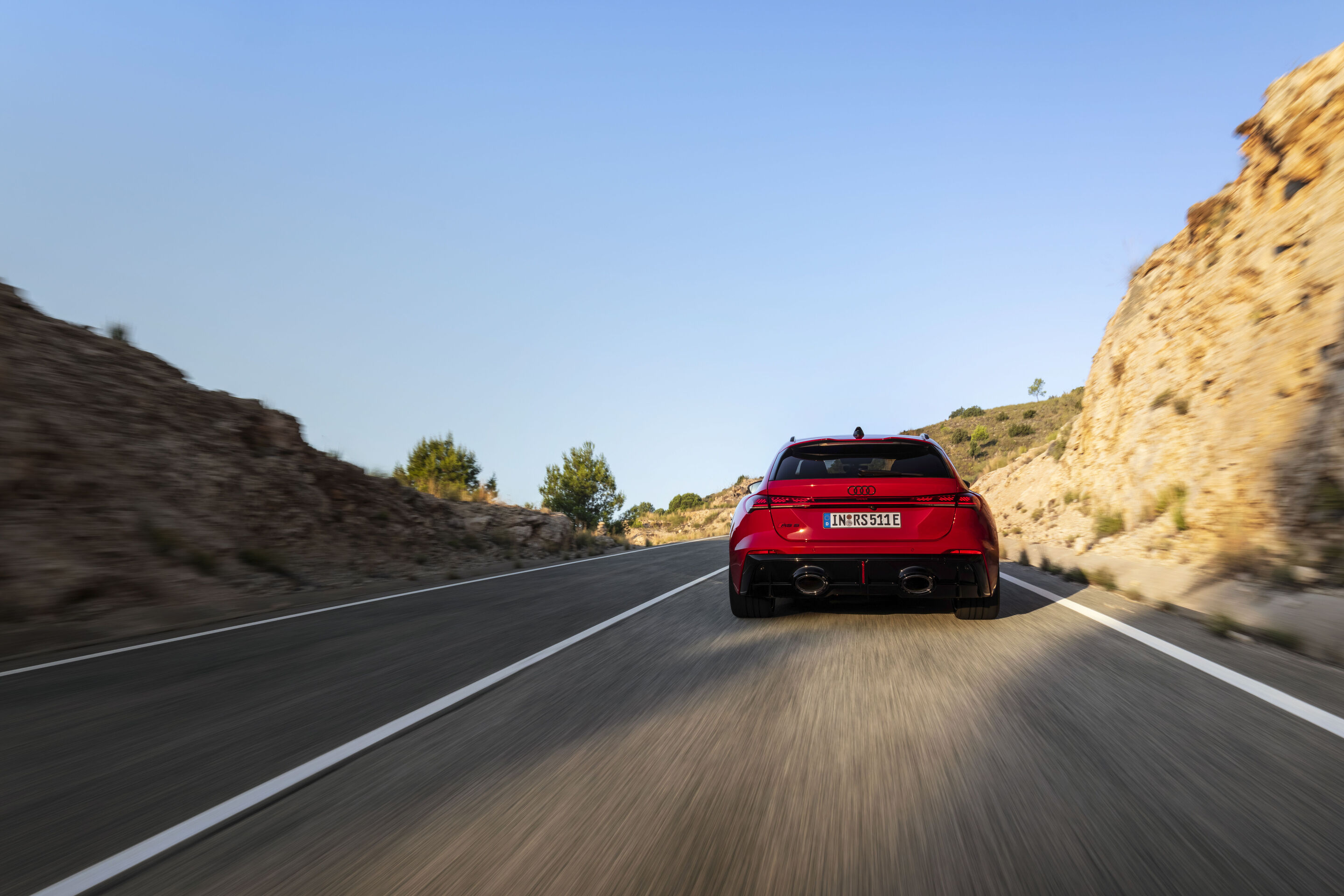 Audi RS 5 Avant - Progressiv red metallic, outdoor dynamic photo, exterior, rear view