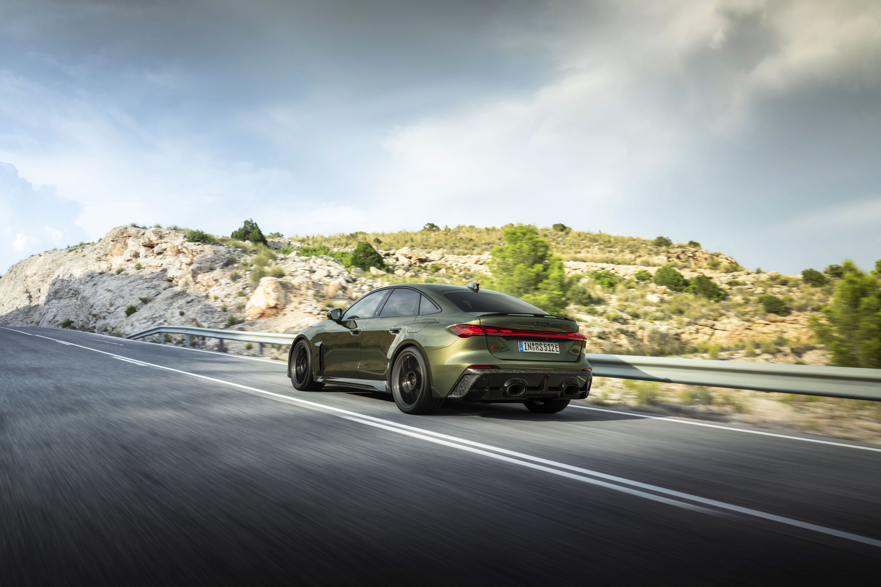 Audi RS 5 Sedan - Bedford green metallic, outdoor dynamic photo, exterior, three-quarter rear view