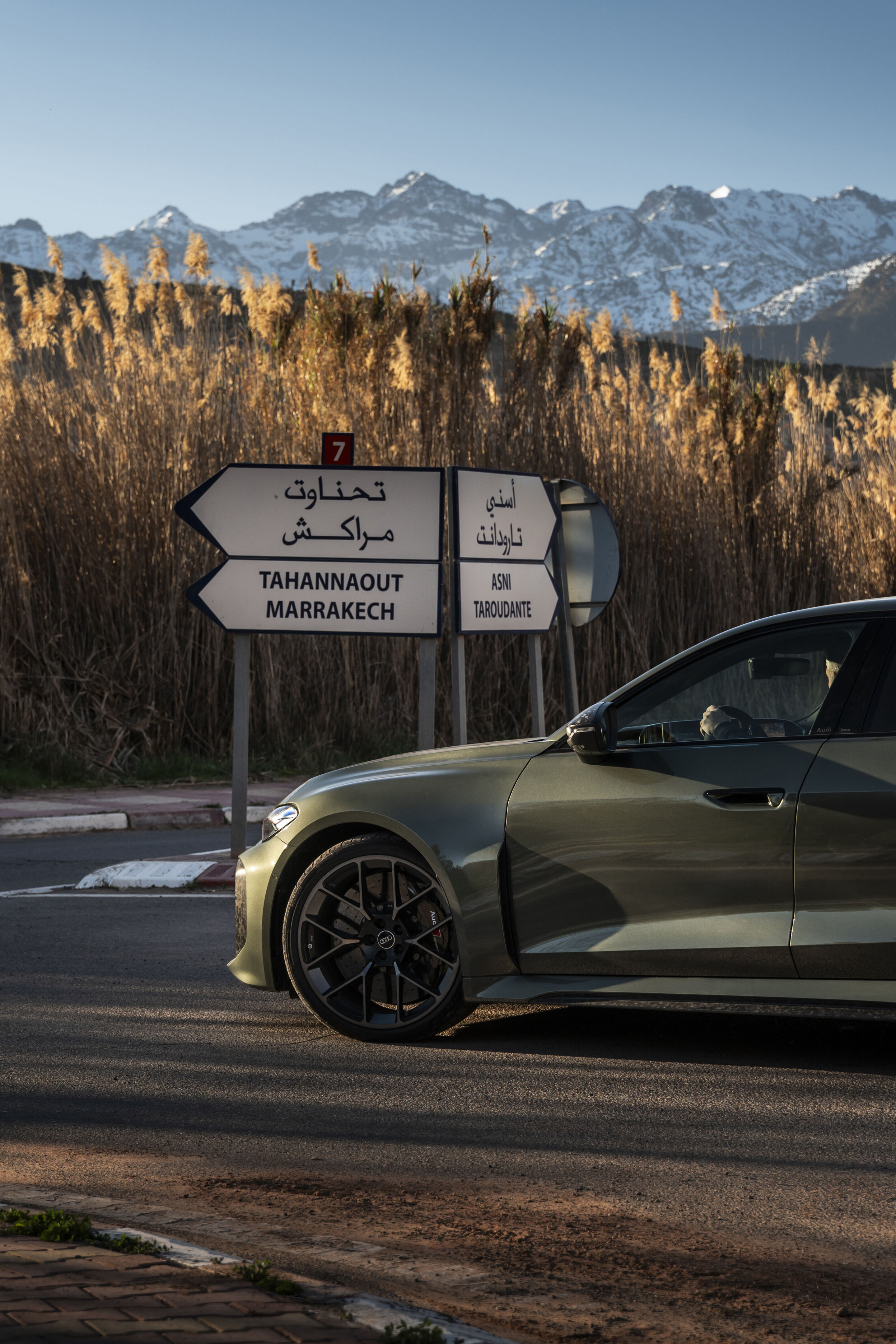 Audi RS 5 Sedan - The Audi RS 5 Sedan in Bedford green at a junction near the Atlas Mountains – expansive scenery meets high performance.