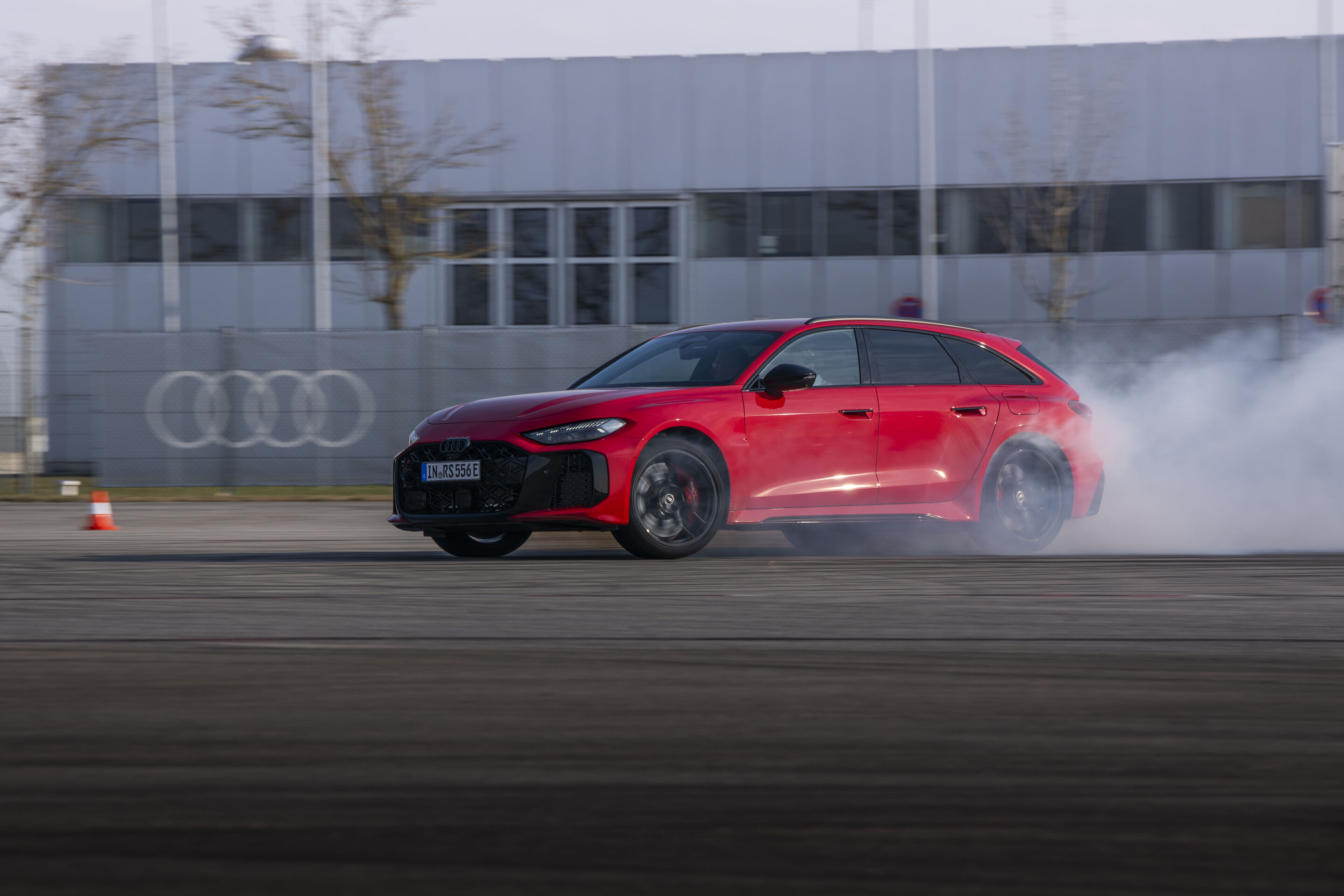 Audi RS 5 Avant - The Progressive red Audi RS 5 Avant in a powerful drifting sequence on the test track.