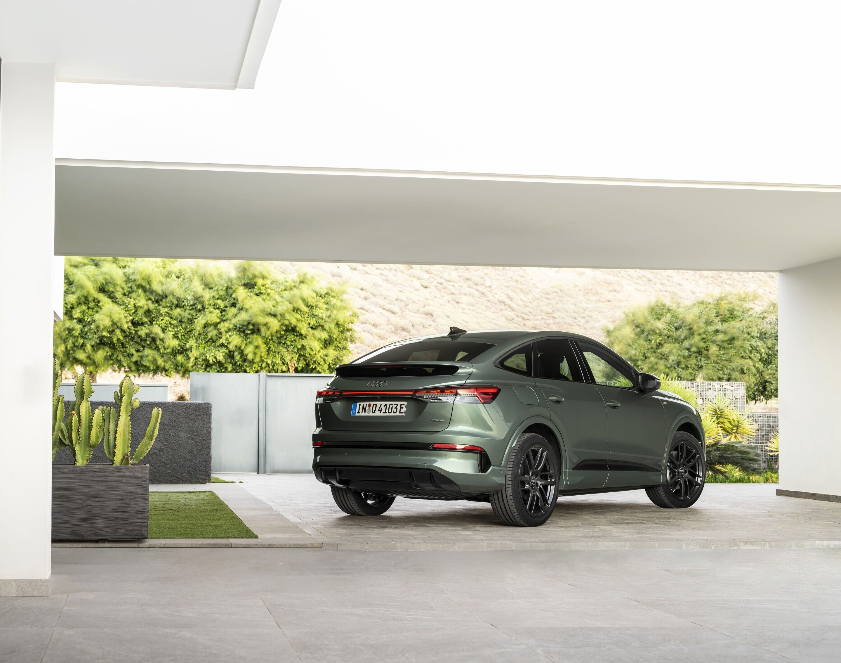 Audi Q4 Sportback e-tron - Sage green metallic, outdoor static photo, exterior, three-quarter rear view