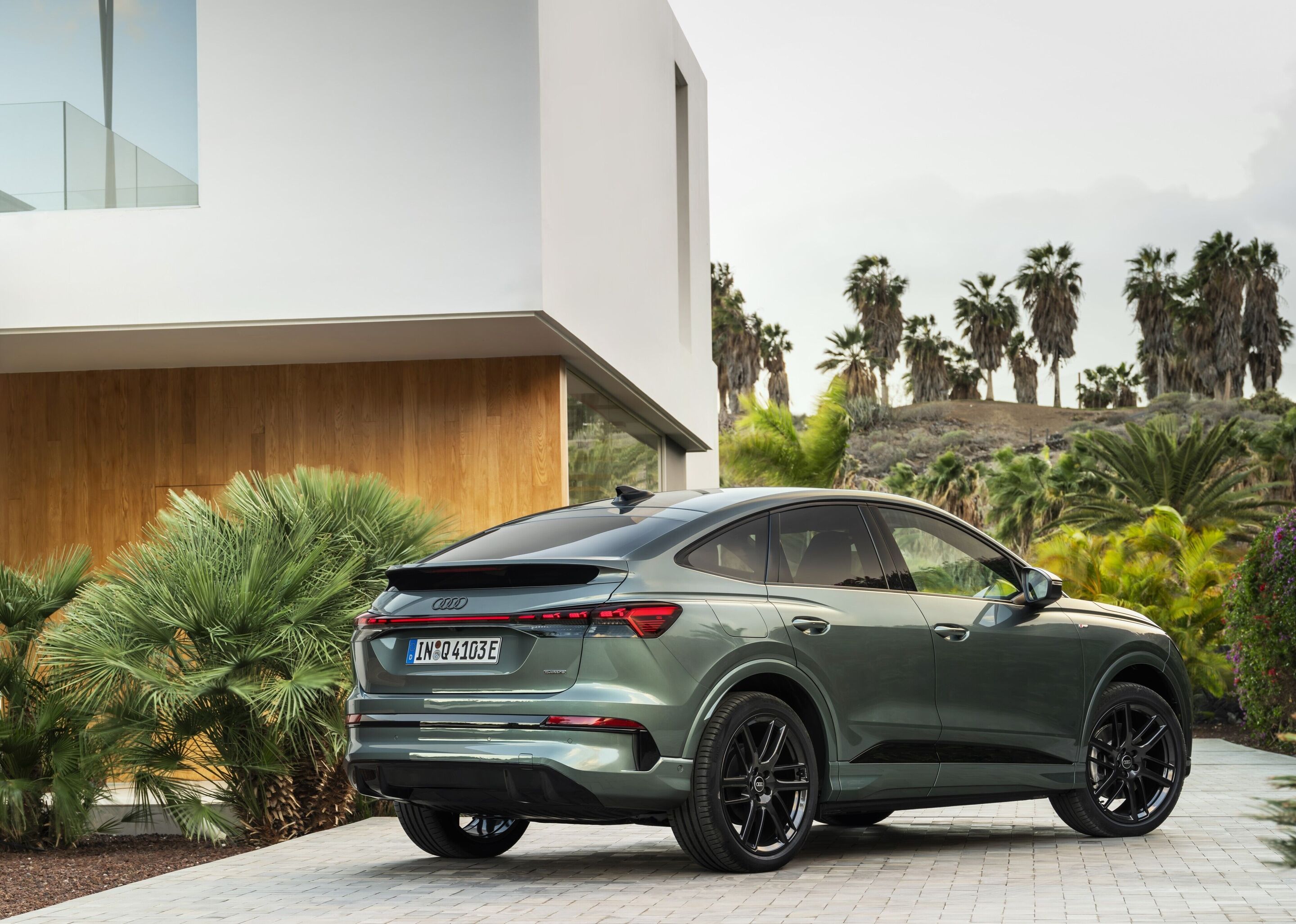 Audi Q4 Sportback e-tron - Sage green metallic, outdoor static photo, exterior, three-quarter rear view