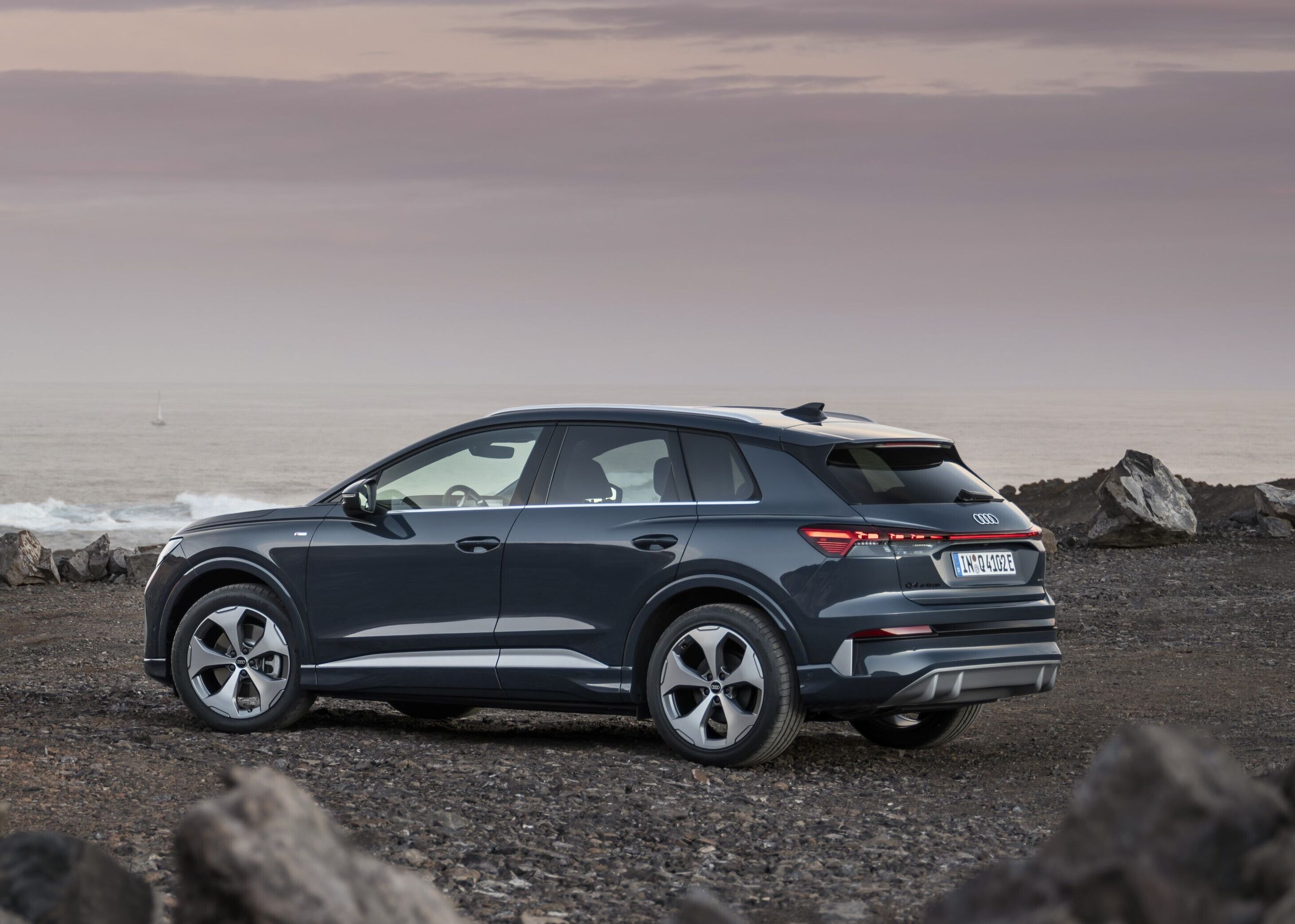 Audi Q4 SUV e-tron - Lavender gray, outdoor static photo, exterior, three-quarter rear view