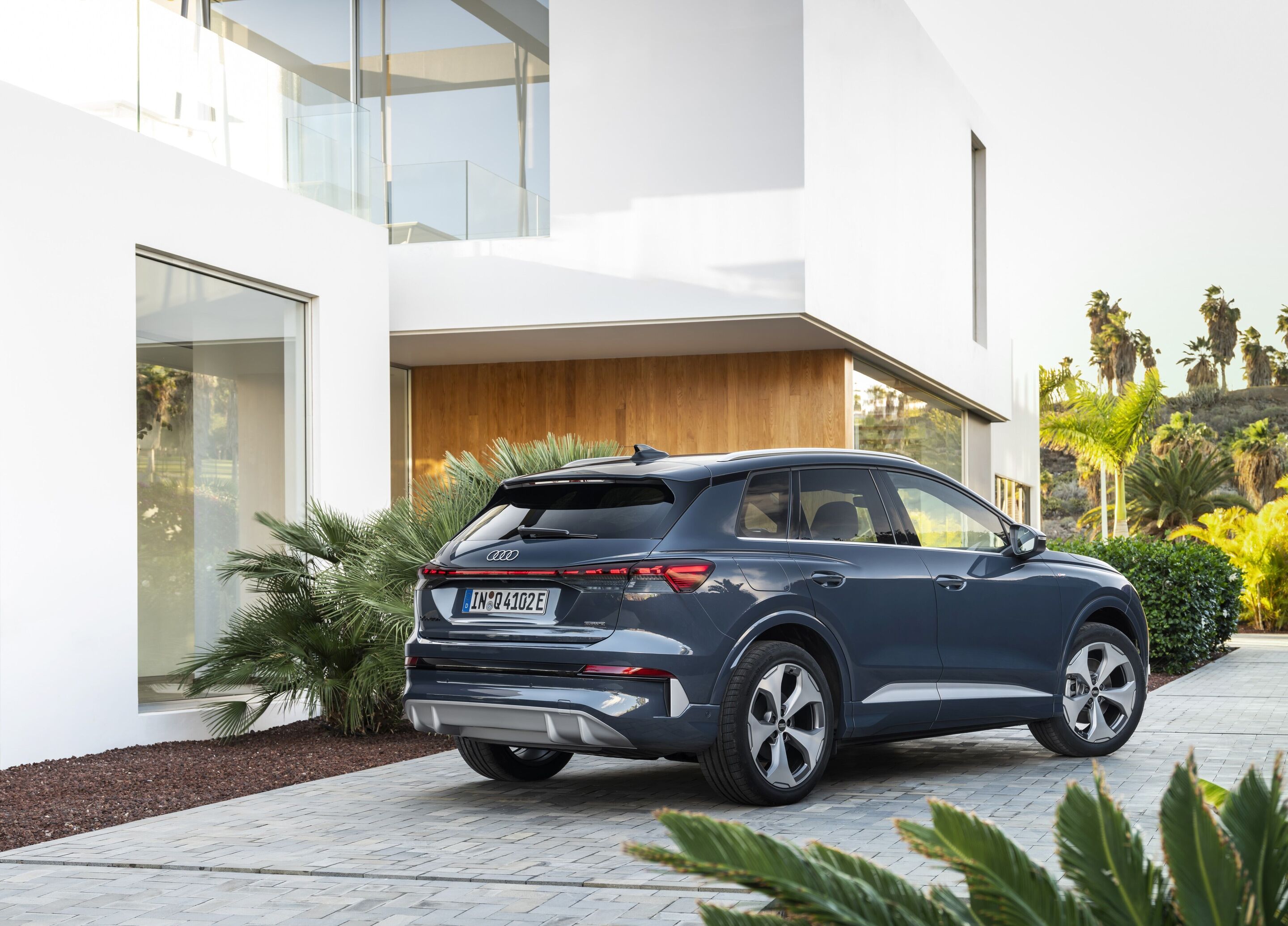 Audi Q4 SUV e-tron - Lavender gray, outdoor static photo, exterior, three-quarter rear view