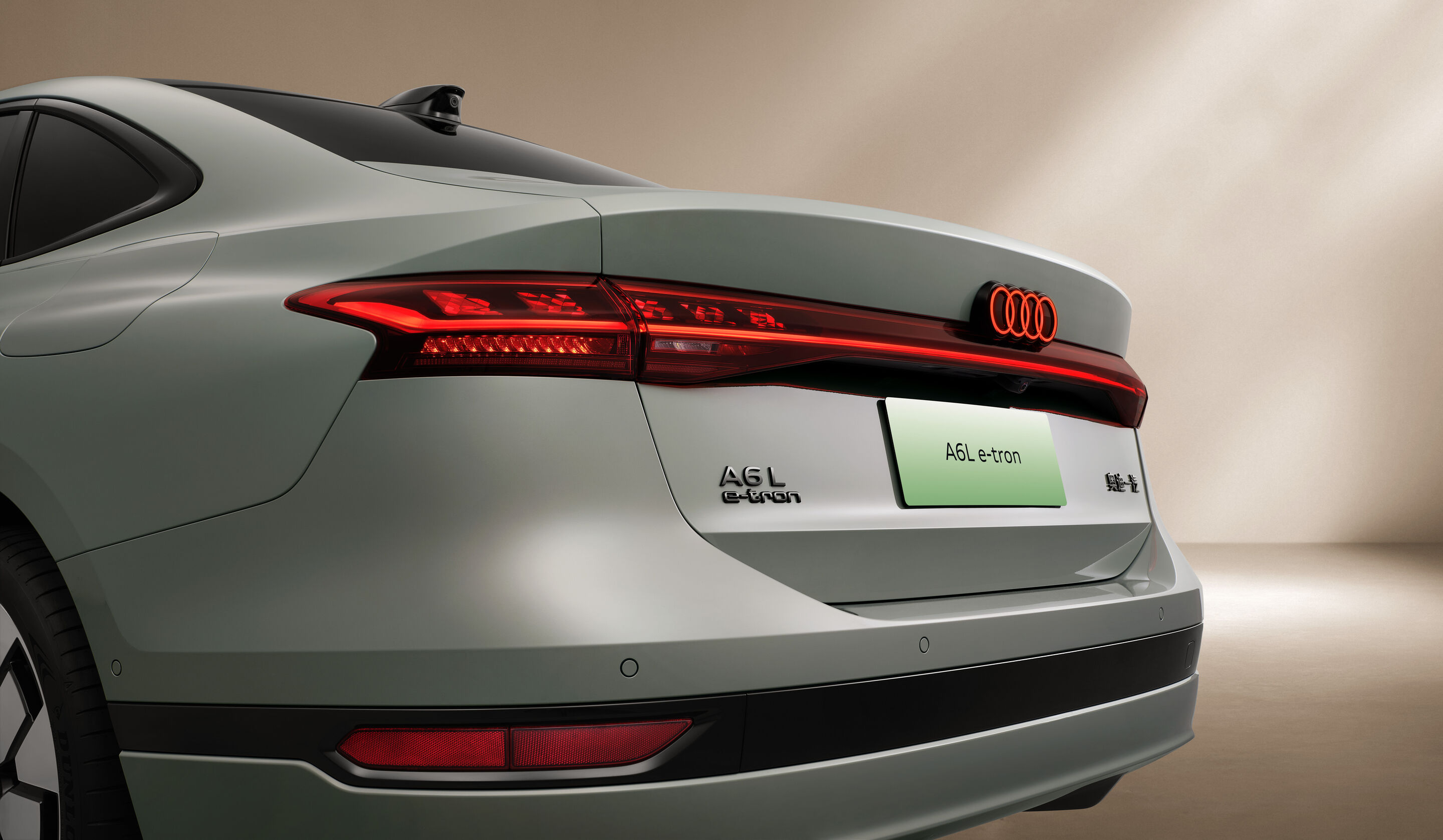 Audi at Auto China 2026 - Detail static shot of the Audi A6L e-tron, exterior, focus on rear lights and model designation
