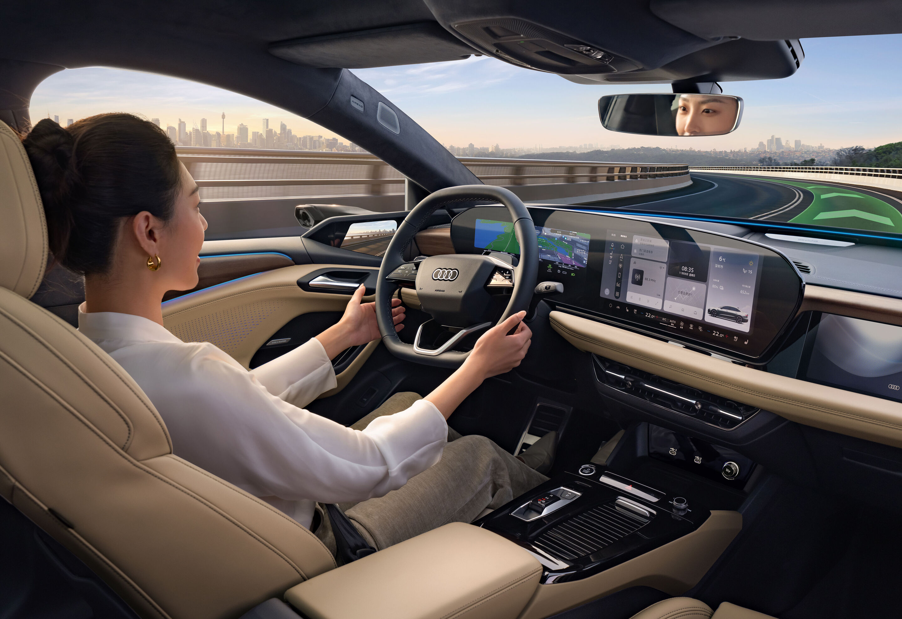 Audi at Auto China 2026 - Outdoor dynamic shot, interior of the Audi A6L e-tron, focus on the steering wheel, MMI displays and driver assistance systems