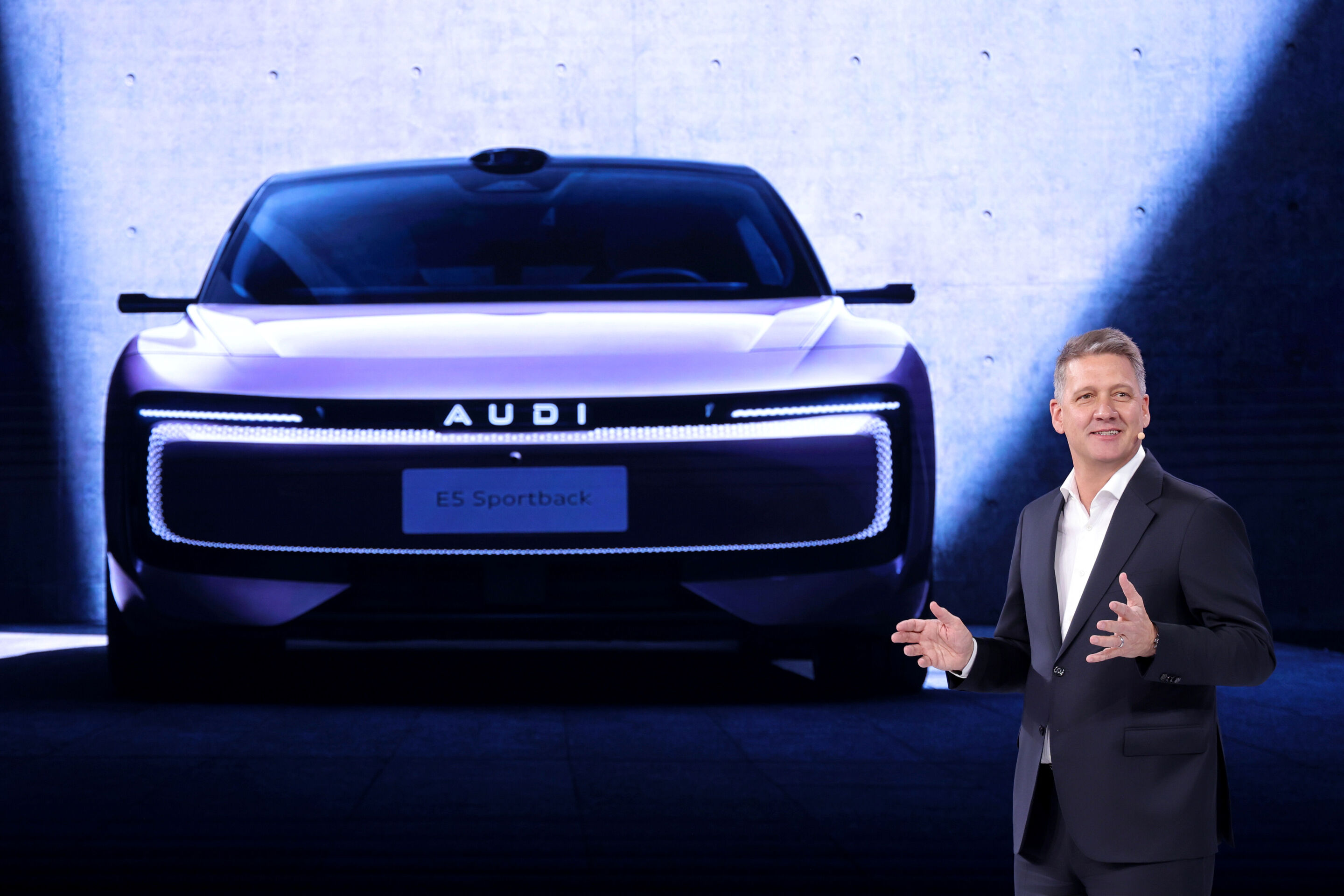 Audi at Auto China 2026 - Audi CEO Gernot Döllner presents the AUDI E5 Sportback.