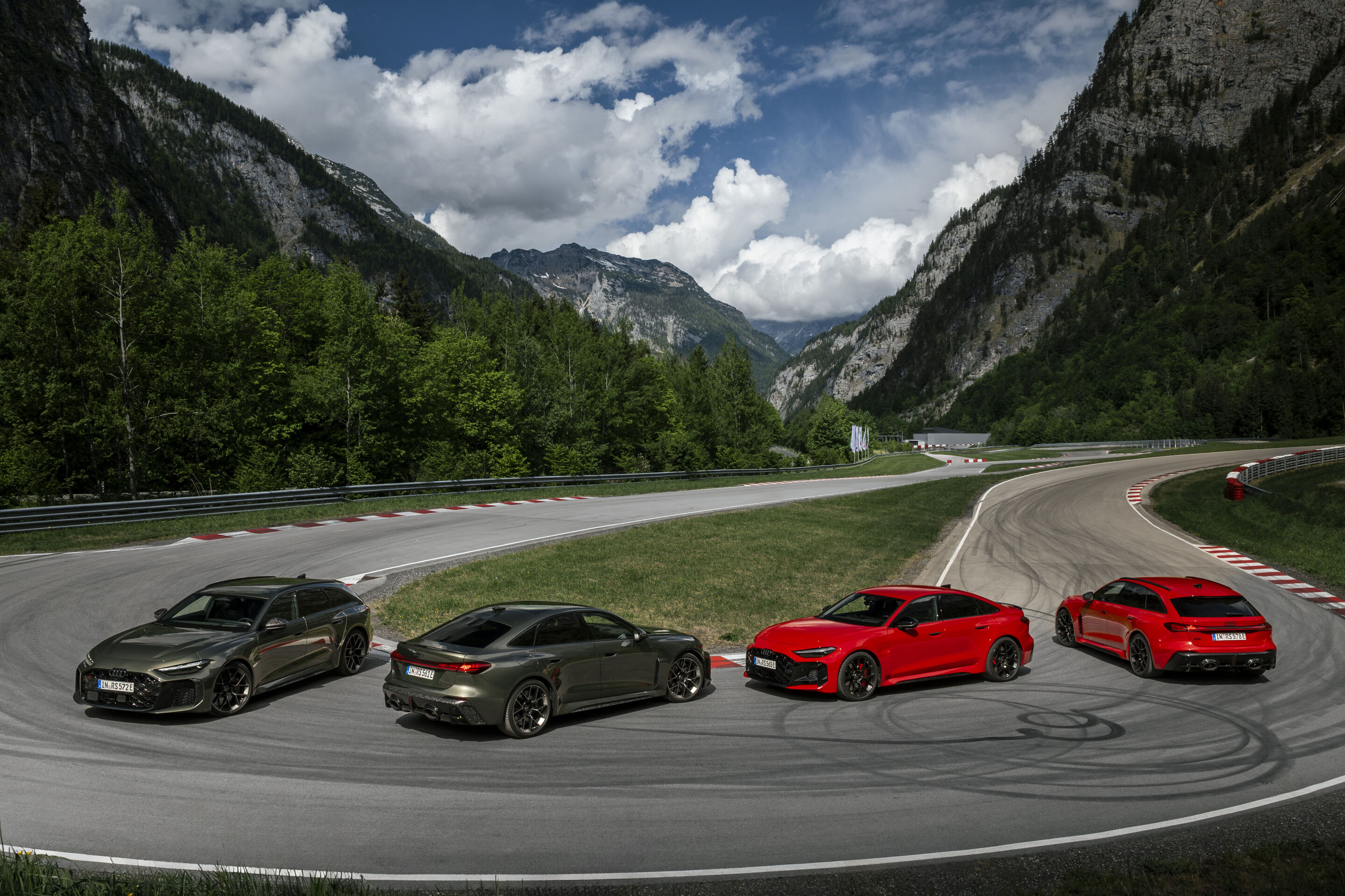 Audi RS 5 Sedan / Audi RS 5 Avant - From left in the image: Audi RS 5 Avant in Bedford green, Audi RS 5 Sedan in Bedford green, Audi RS 5 Sedan in Progressive red, and Audi RS 5 Avant in Progressive red, outdoor static shot, exterior, in an alpine landscape.