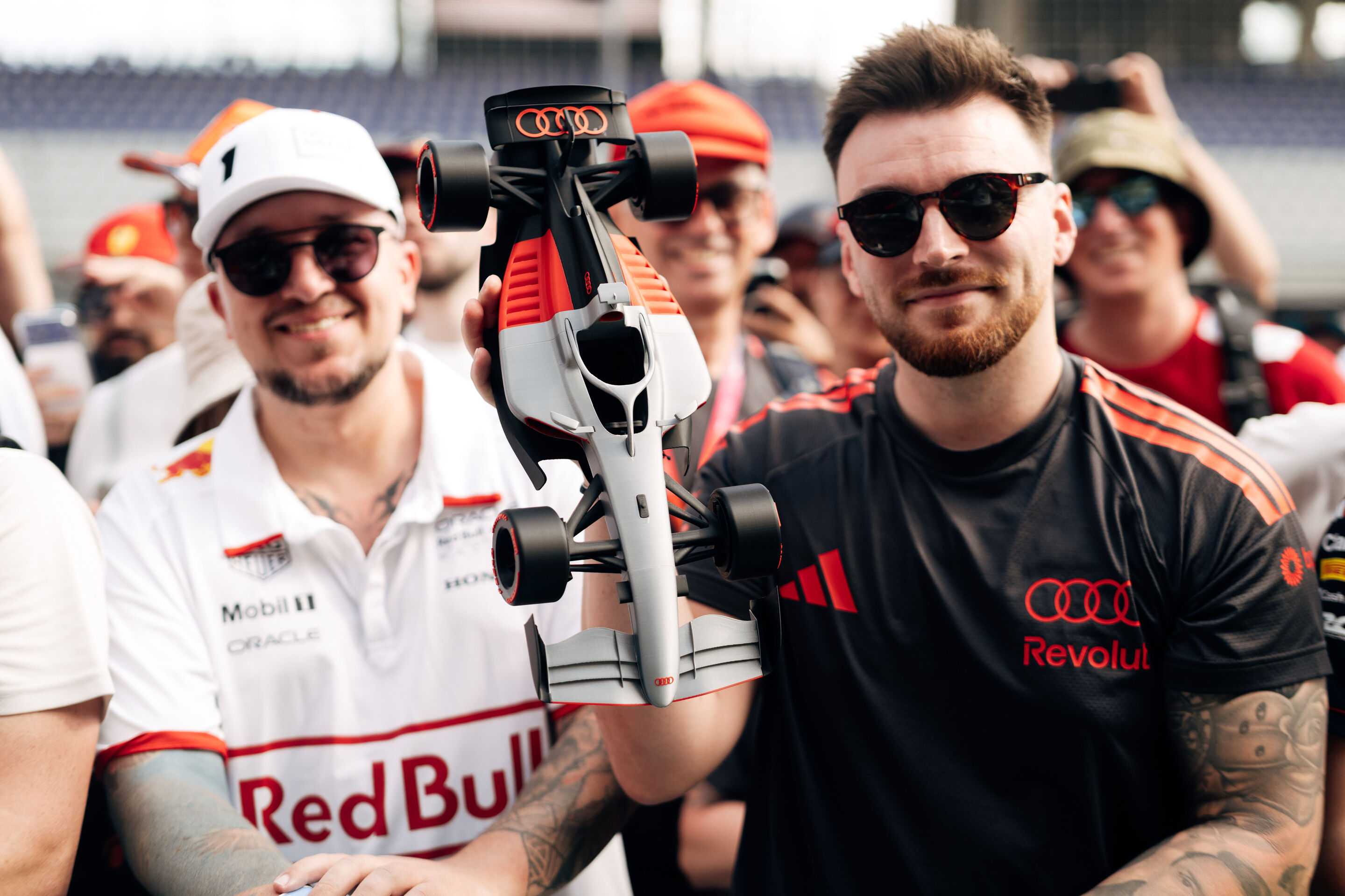 Audi Revolut F1 Team: Austrian Grand Prix - Fan with a model of the Audi R26