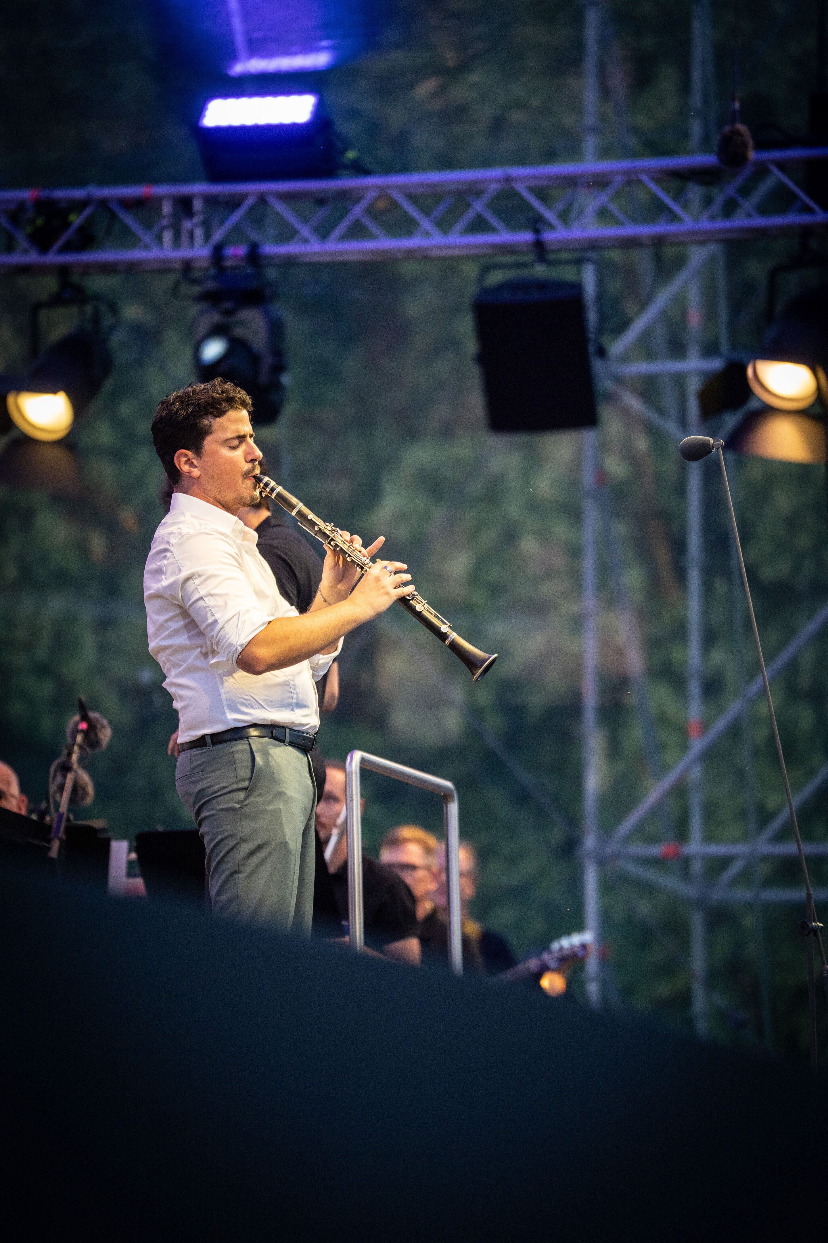 The Audi Wind Orchestra at the opening concert/classical open-air concert in Klenzepark - Clarinet soloist Elad Navon performs on stage at the opening concert of the 2026 Audi Summer Concerts in Klenzepark.