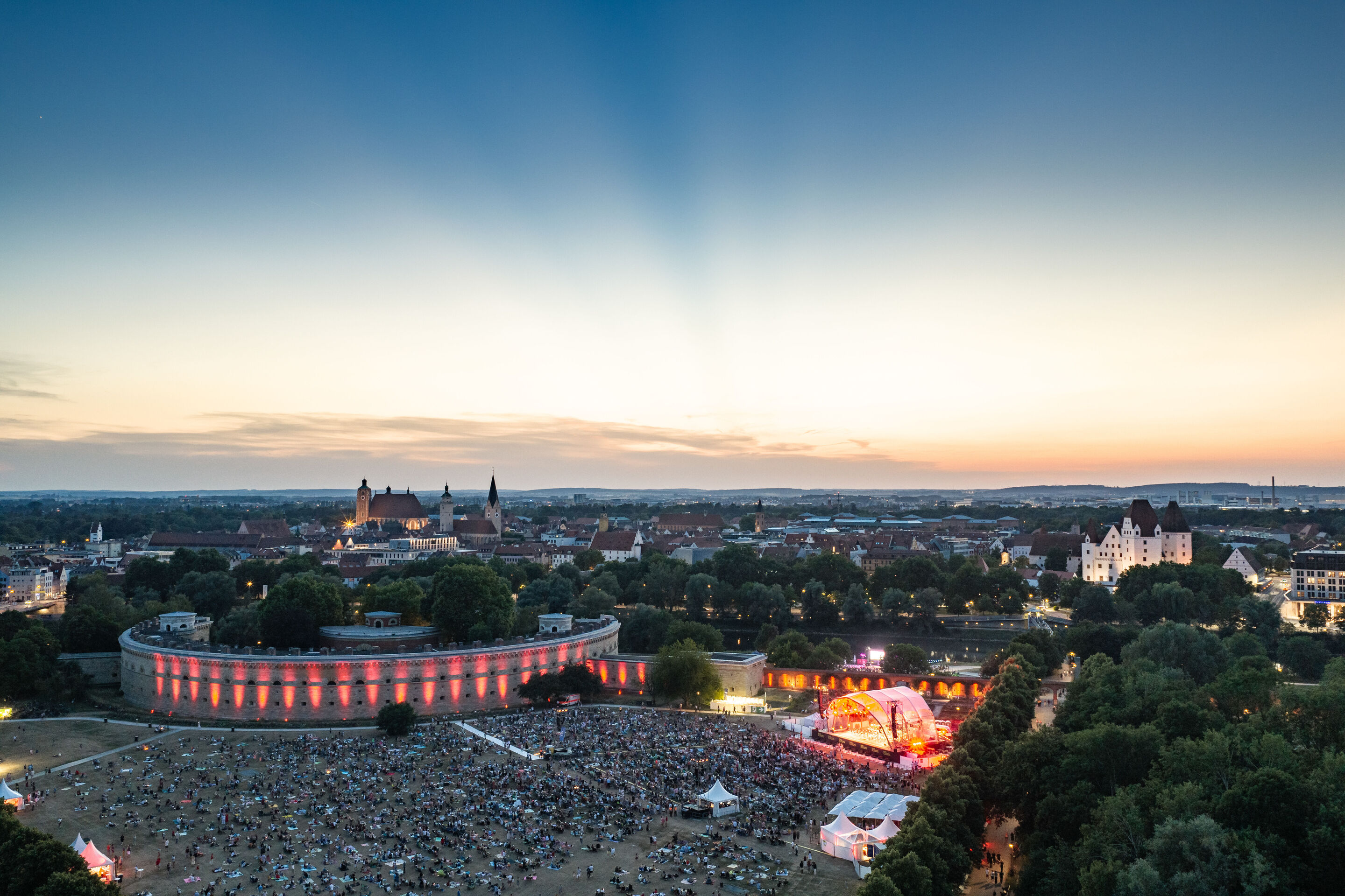 The Audi Wind Orchestra at the opening concert/classical open-air concert in Klenzepark - Aerial view of Klenzepark: Around 6,000 visitors gather in front of the big open-air stage for the opening concert of the 2026 Audi Summer Concerts, featuring the...