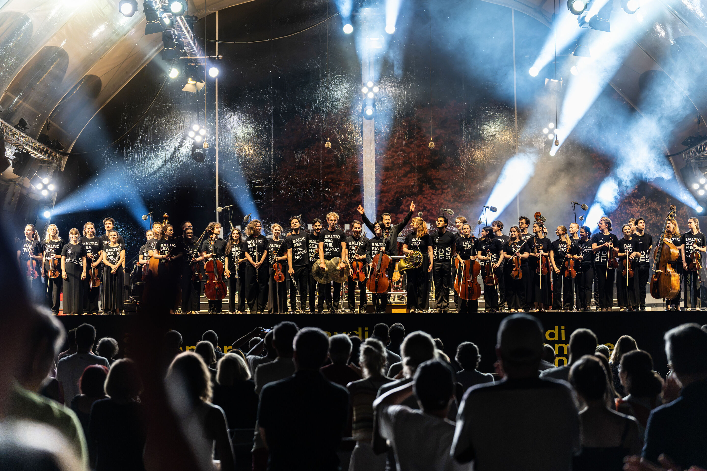 Baltic Sea Philharmonic performing at the classical open-air concert in Klenzepark - View from the audience towards the stage of the 2026 Classical Open-Air Concert in Klenzepark: The musicians of the Baltic Sea Philharmonic take their final bow in front...