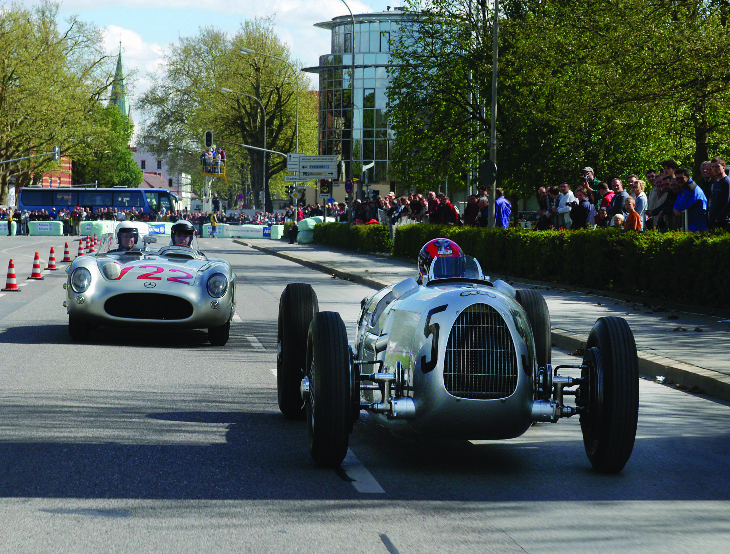 Attractions at the Donau Ring 2003: Apart from the legendary Auto Union race car Type C from 1936 (right) also the Mille Miglia winner from 1955, a Mercedes 300 SLR, drove the 1.6-kilometre course around the old part of the city of Ingolstadt. Daimler-Chrysler Classic took part at the Donau Ring for the first time, at the invitation of Audi Tradition